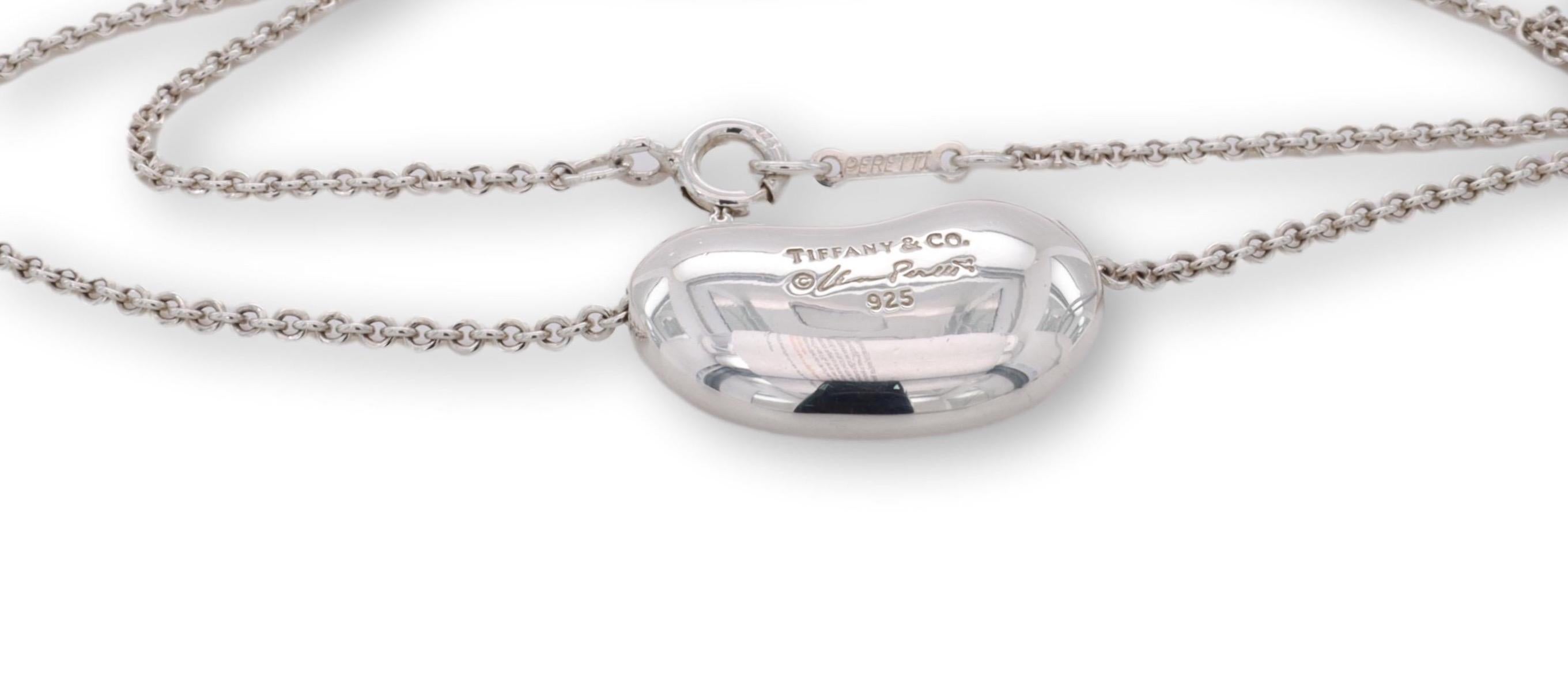 Tiffany & Co. pendant necklace finely crafted in sterling silver featuring an 18 mm bean motif slider pendant hanging off an 18