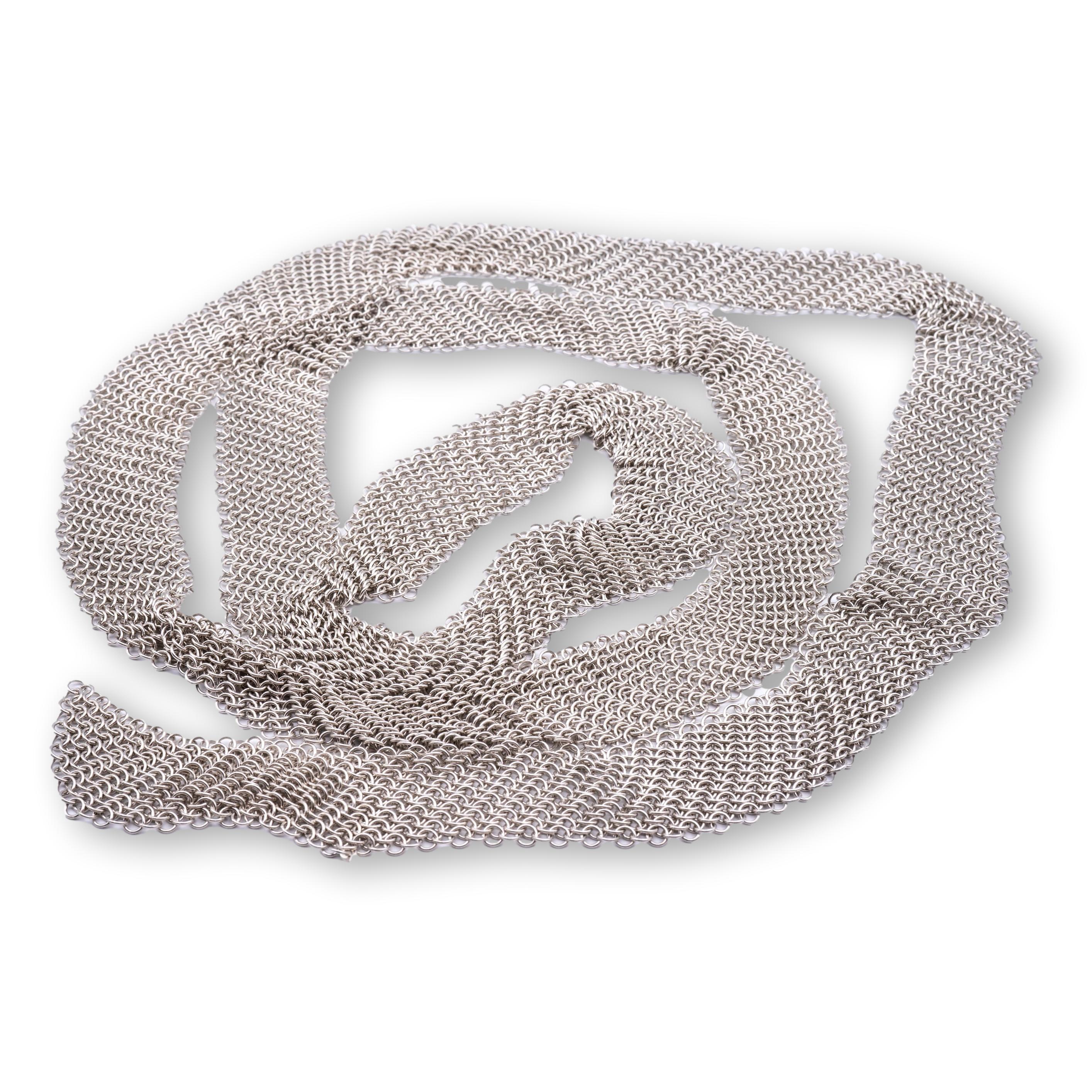 Tiffany & Co. Mesh Tie Scarf / Necklace from the Elsa Peretti Collection finely crafted in sterling silver with a woven mesh chain link design throughout , measuring 49