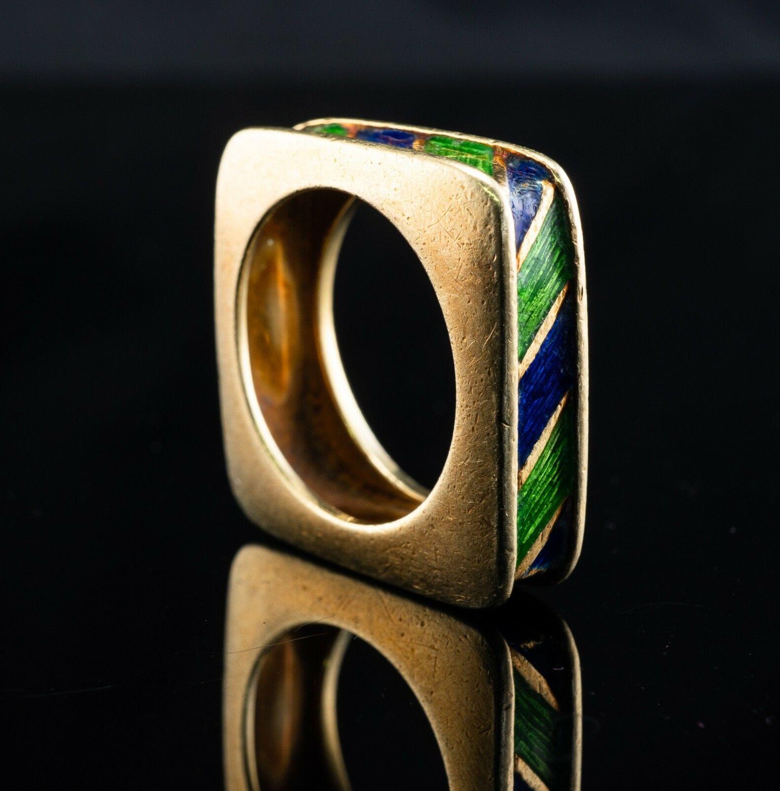 This rare and highly collectible Tiffany ring is crafted in solid 18K gold. Blue and green enamel is in good vintage condition except for minor enamel wear in one corner. The width of the band is 6mm and the ring is 3mm thick, on the corners, it is