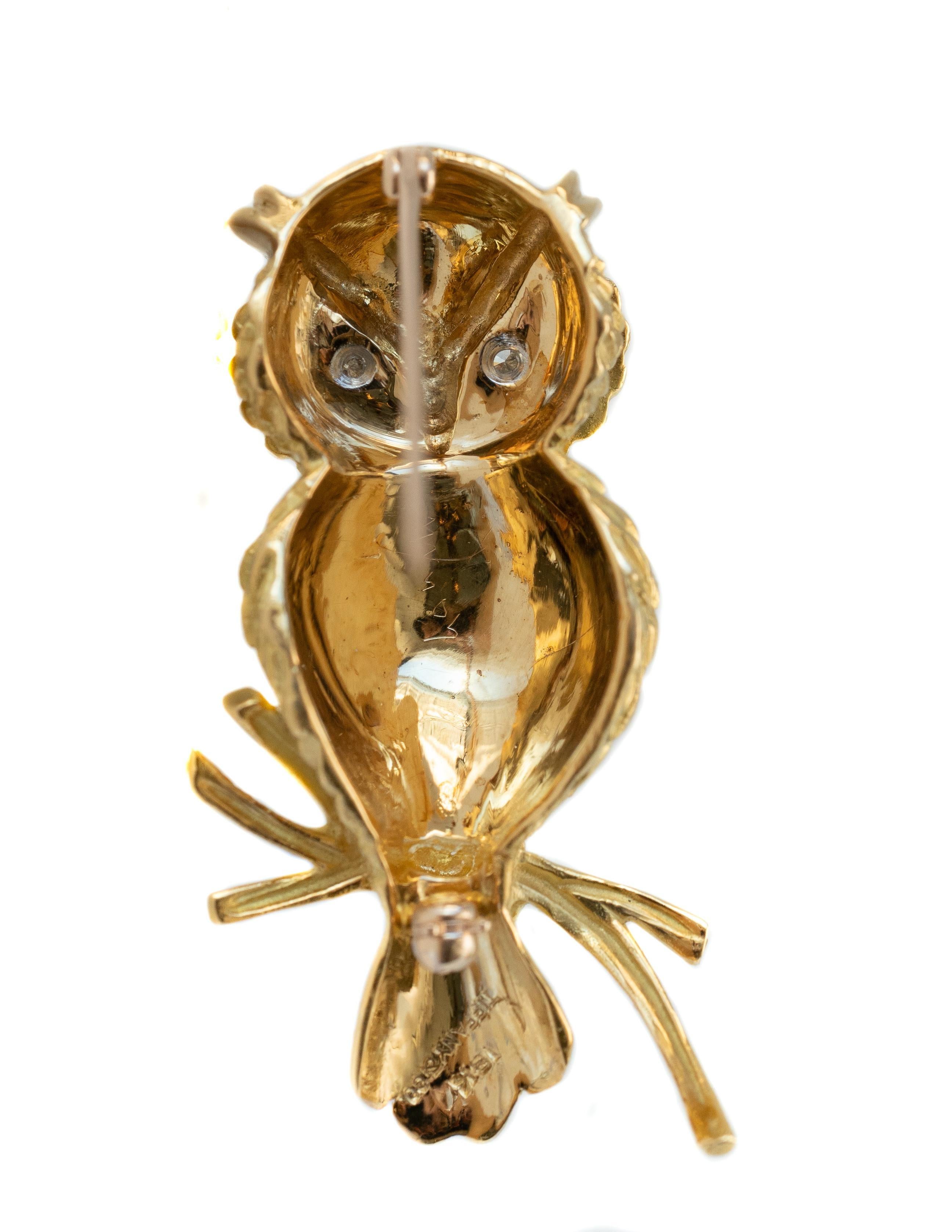 Tiffany and Co. Gold Owl Brooch - 18 karat Yellow Gold, Diamonds

Features:
18 karat Yellow Gold
2 Round Brilliant Diamond Eyes
Feather Textured Gold Wings, Tail and Face
Owl is perched on a polished gold Branch
4.5 x 2.5 x 1.0 centimeters 
Prong