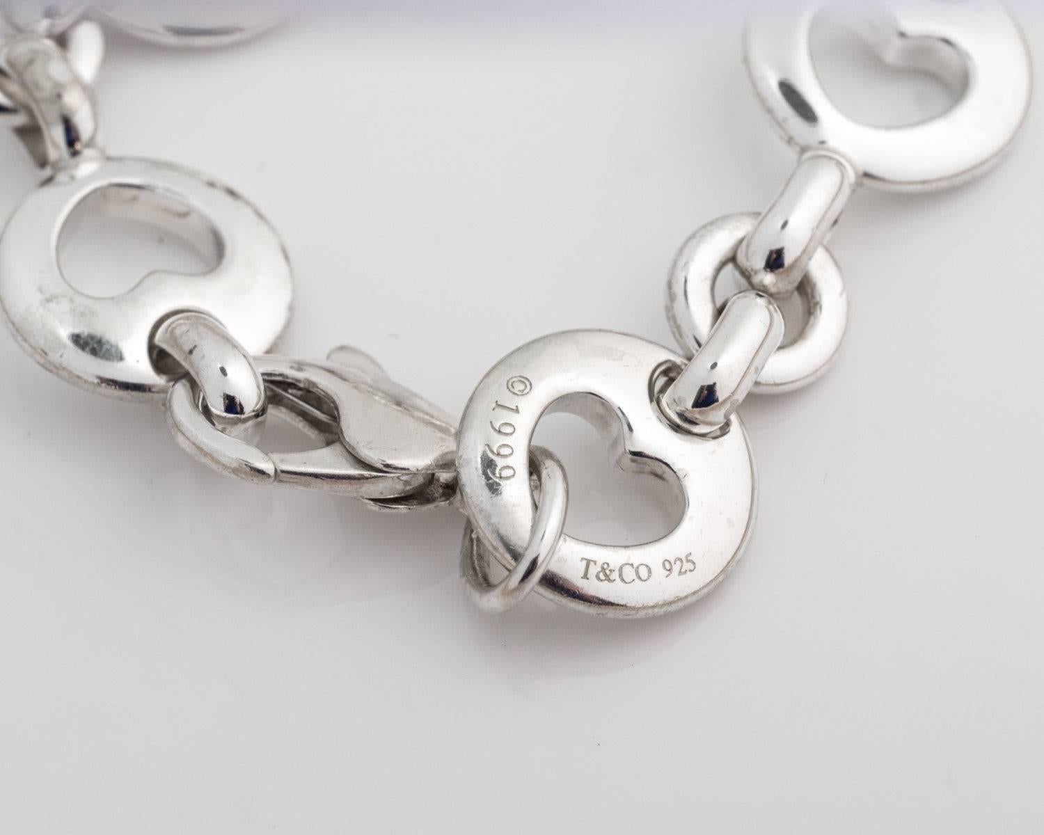 Tiffany and Co. Heart Cutout Link Charm Bracelet - Sterling Silver

In 1999 Tiffany and Co. made this Limited Edition bracelet along with other items for a turn of the century collection. 
Each round link has a heart cutout in the middle. Three