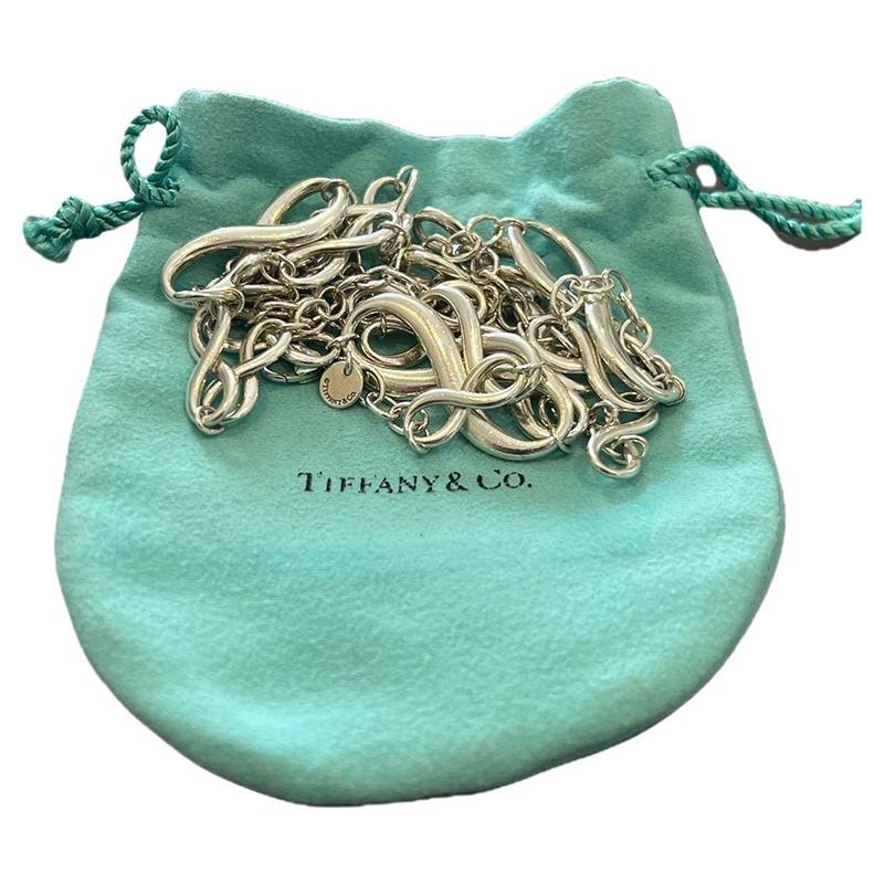 Tiffany and Co Infinity Statement Necklace in Sterling Silver. 

90cm in length.

Extremely Rare Piece - DISCONTINUED IN 2015

Metal: 925 Sterling Silver
Carat: N/A
Colour: N/A
Clarity:  N/A
Cut: N/A
Weight: 50.0 grams
Engravings/Markings: T&CO.