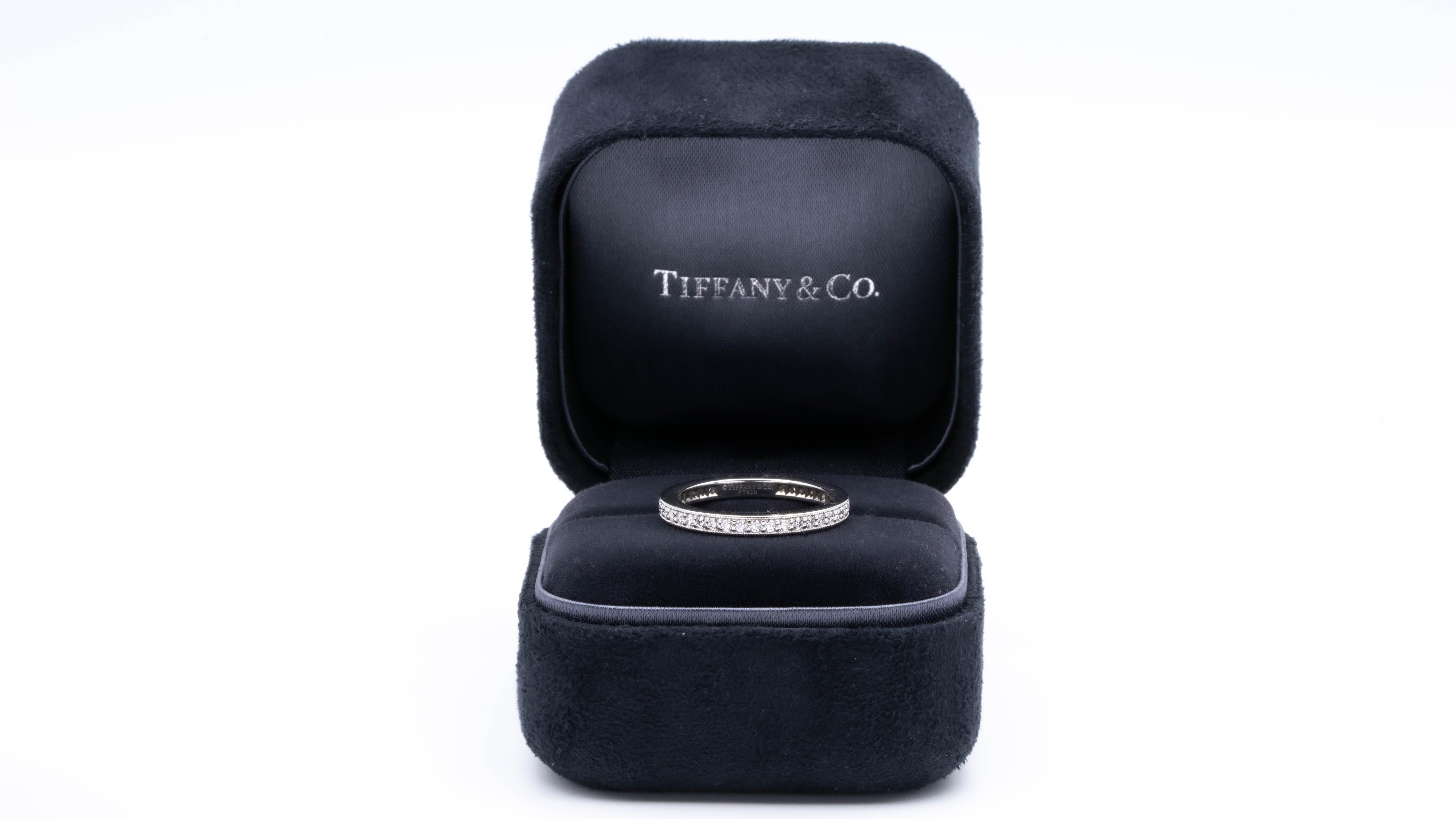 Tiffany & Co. Legacy Eternity band with full circle of round brilliant cut diamonds bead set in a mil-grain edge channel,  weighing 0.41 carats total weight.
This design give the band an antique Edwardian look. 
Comes in Tiffany Box 

Stamp: Tiffany