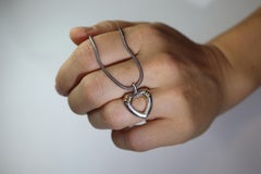 Tiffany and Co Open Heart Pendant. 18k and Sterling Silver