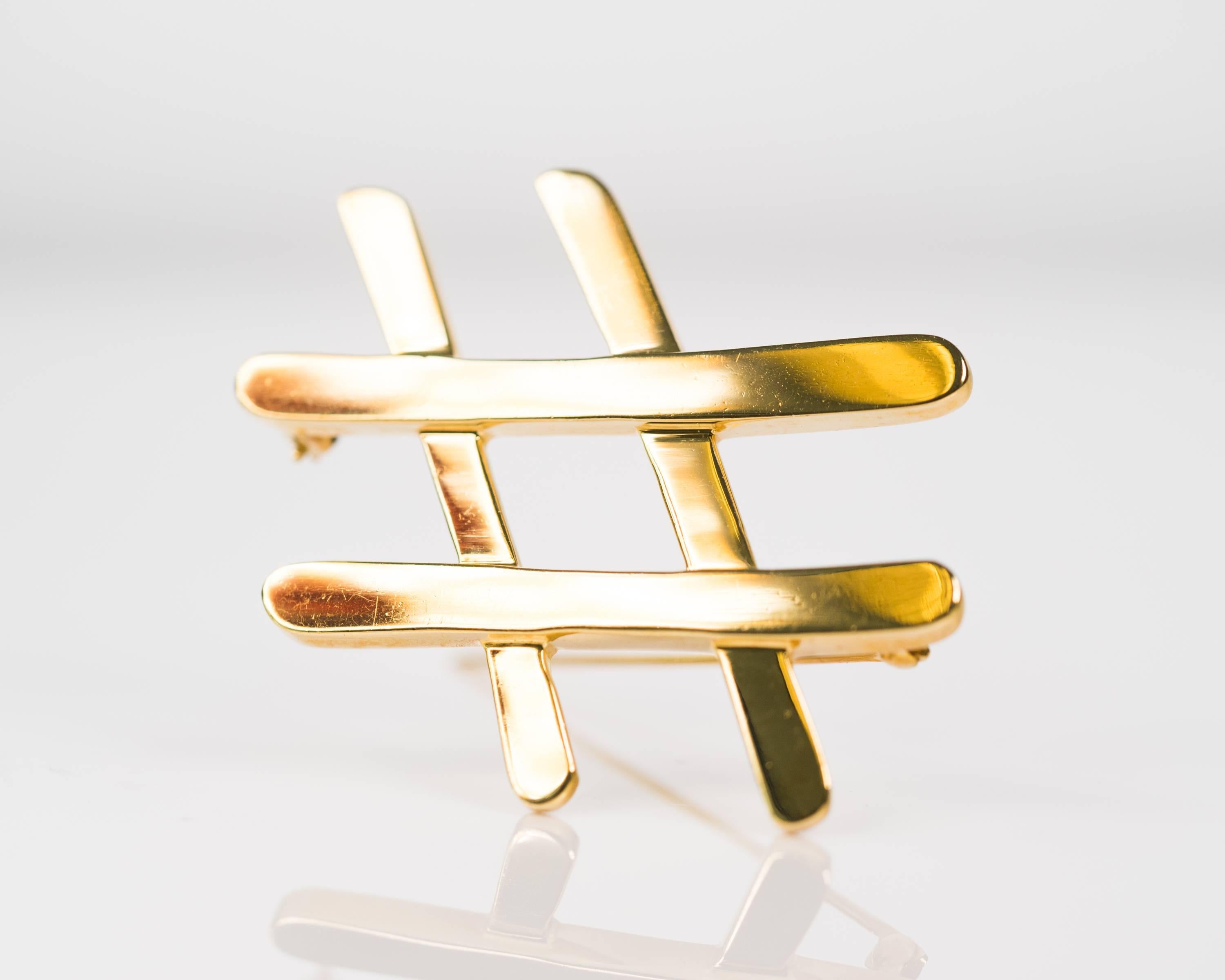Paloma Picasso for Tiffany and Co. Hashtag Pin Brooch - 18 Karat Yellow Gold

Hashtag Brooch in 18 Karat Yellow Gold! 
High polish, rich Gold Hashtag Pin measures approximately 1.75 inches wide x 1.75 inches long.
Designed by Paloma Picasso, this
