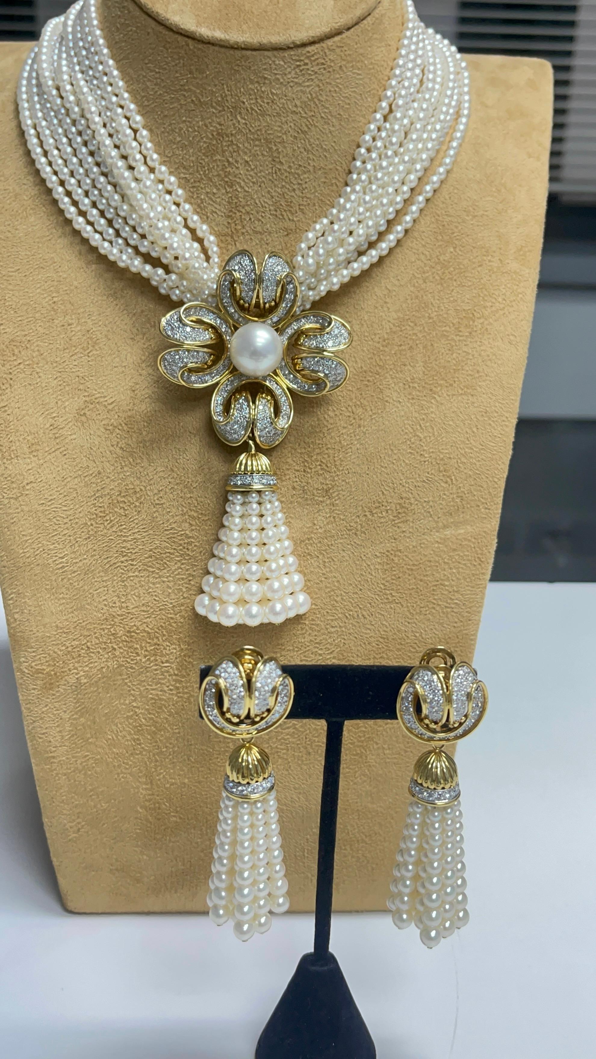 This absolute stunner Tiffany and Co  pearl and diamond Necklace /brooch with earrings beautifully hand crafted in 18 karat gold and platinum with Tiffany & co stamp on necklace and earrings. 
This set can be worn in multiple ways : necklace with or
