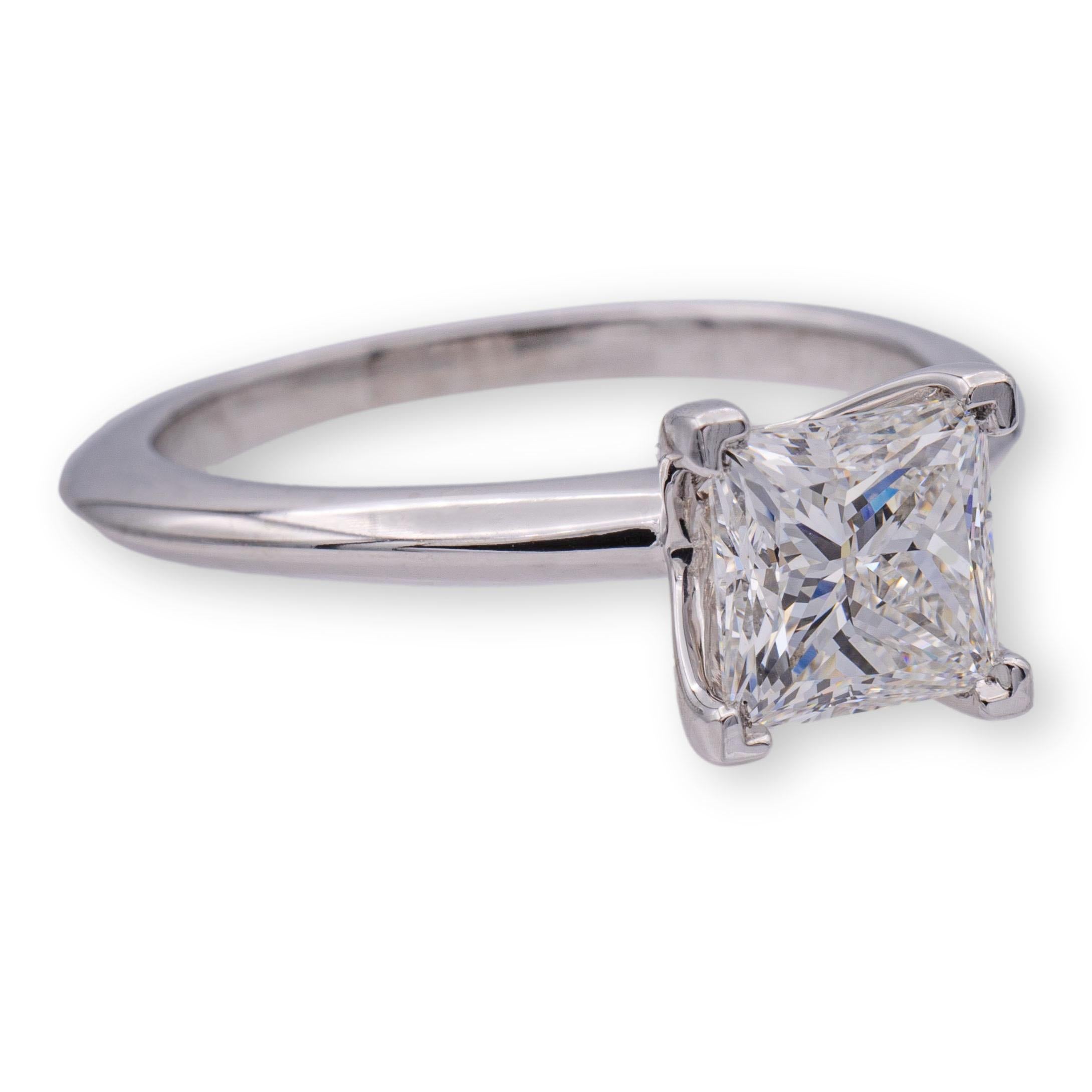 Tiffany & Co. Diamond Engagement ring featuring a princess cut 1.04 ct Center, graded F color and VS1 Clarity finely crafted in Platinum.  This diamond Includes an Original Tiffany certificate. Ring is fully hallmarked with Tiffany logos, serial