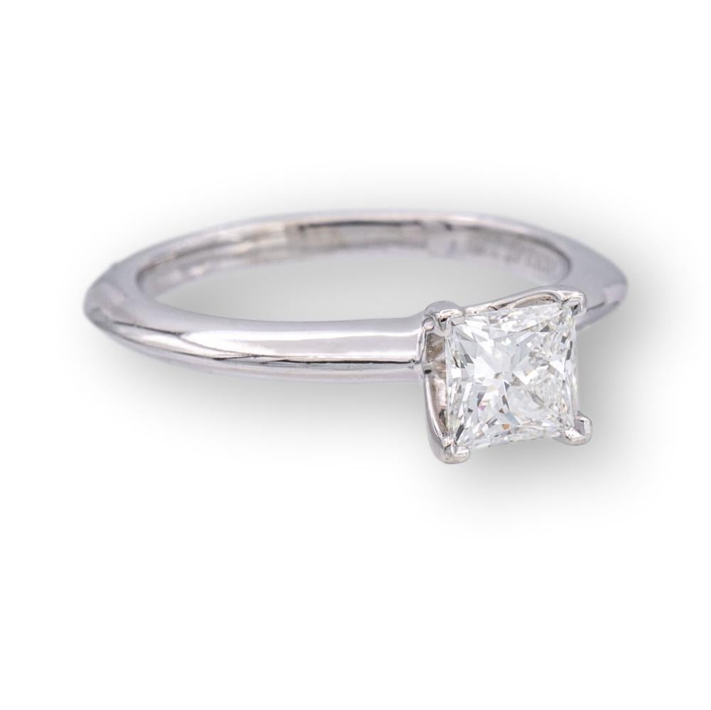 Tiffany & Co. Diamond Engagement ring featuring a princess cut 0.50 ct Center, graded F color and VVS2 Clarity finely crafted in Platinum.  This diamond Includes an Original Tiffany certificate. Ring is fully hallmarked with Tiffany logos, serial