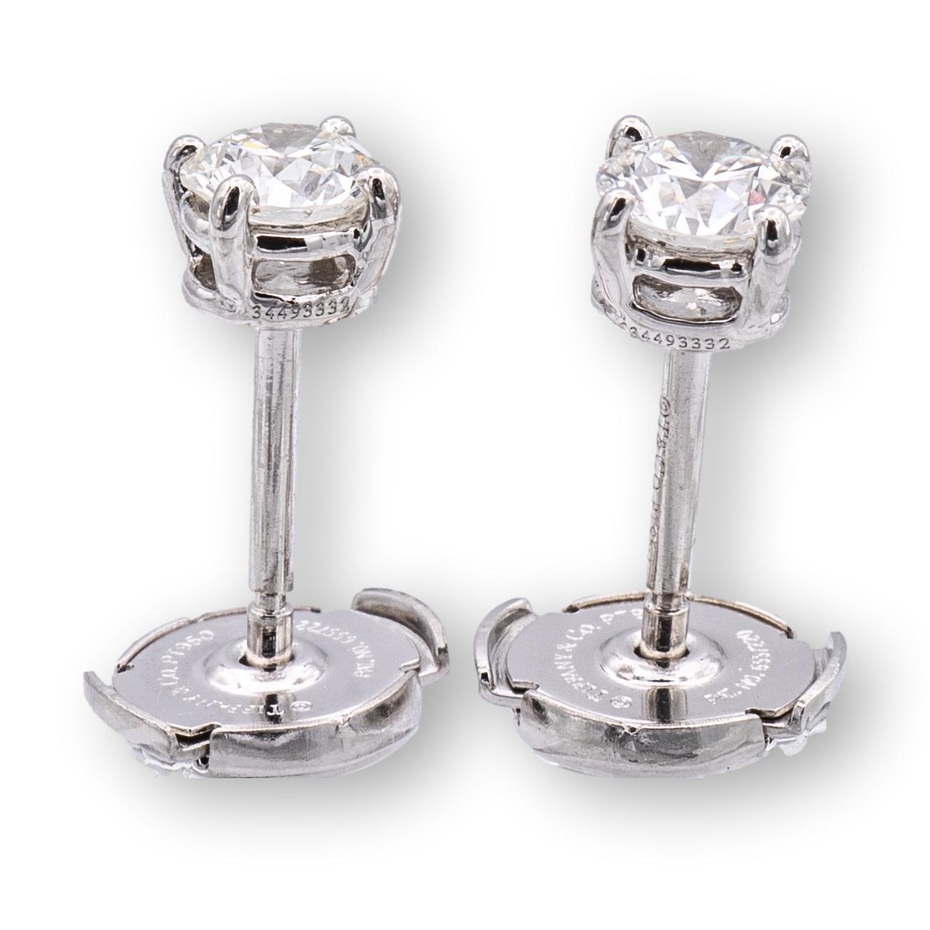 Pair of Tiffany & Co. Diamond Stud earrings finely crafted in a Platinum 4 prong basket setting featuring two perfectly matched round brilliant cut diamonds weighing 0.76 carats total weight. One round brilliant diamond weighs 0.38 carats graded J