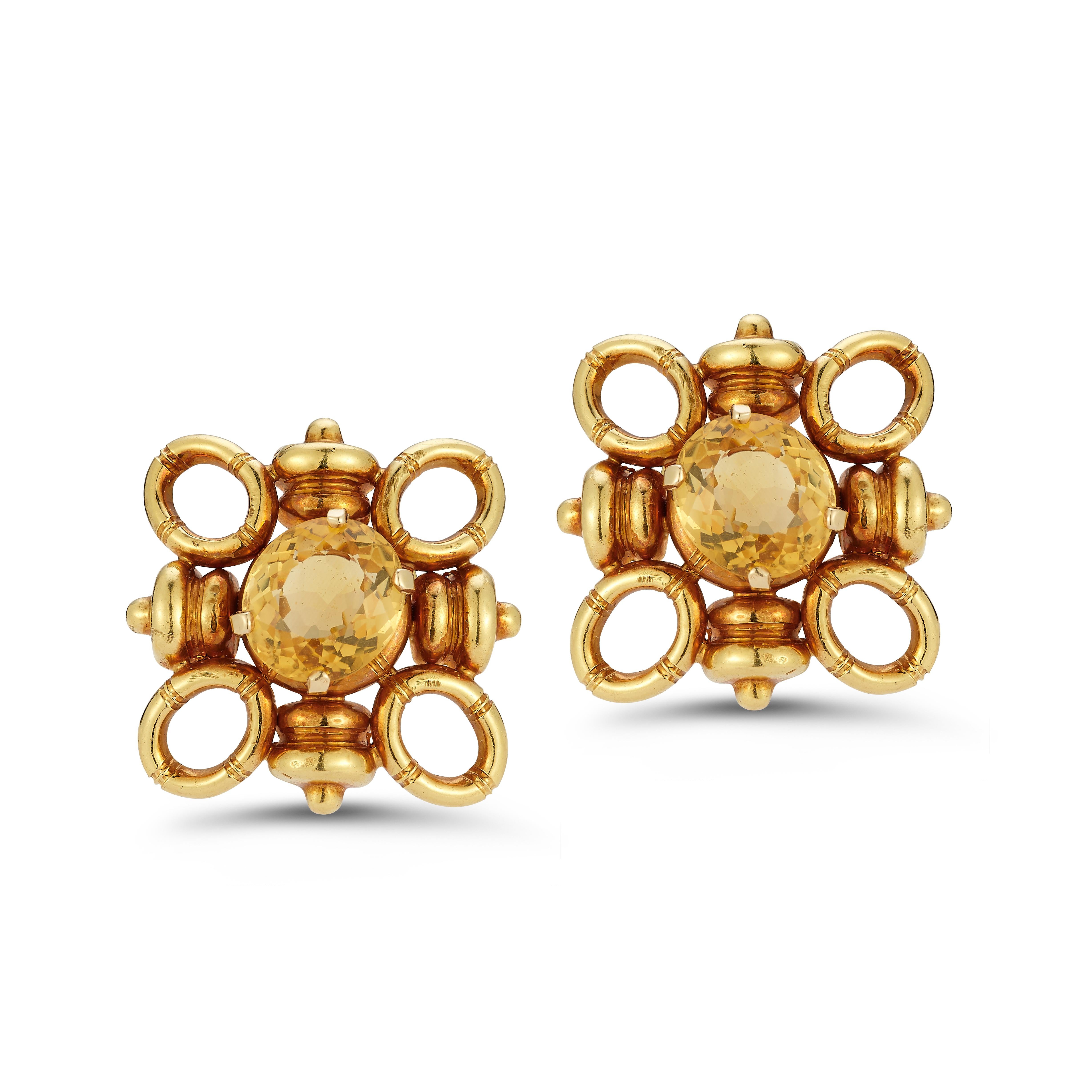 Tiffany and Co Retro Citrine Earrings

A pair of oval cut citrines surrounded by a quatrefoil motif  18k yellow gold setting.

Measurements: 1