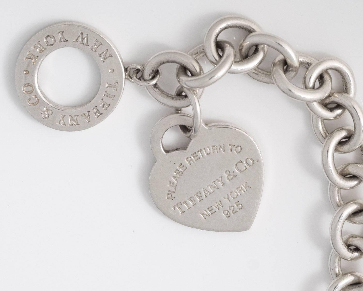 Tiffany and Co. Return to Tiffany Heart Toggle Bracelet - Sterling Silver

Features Sterling Silver open links, a Heart Tag Charm and a Toggle Clasp. This beautiful Tiffany and Co. classic bracelet looks gorgeous worn alone, with a watch or layered