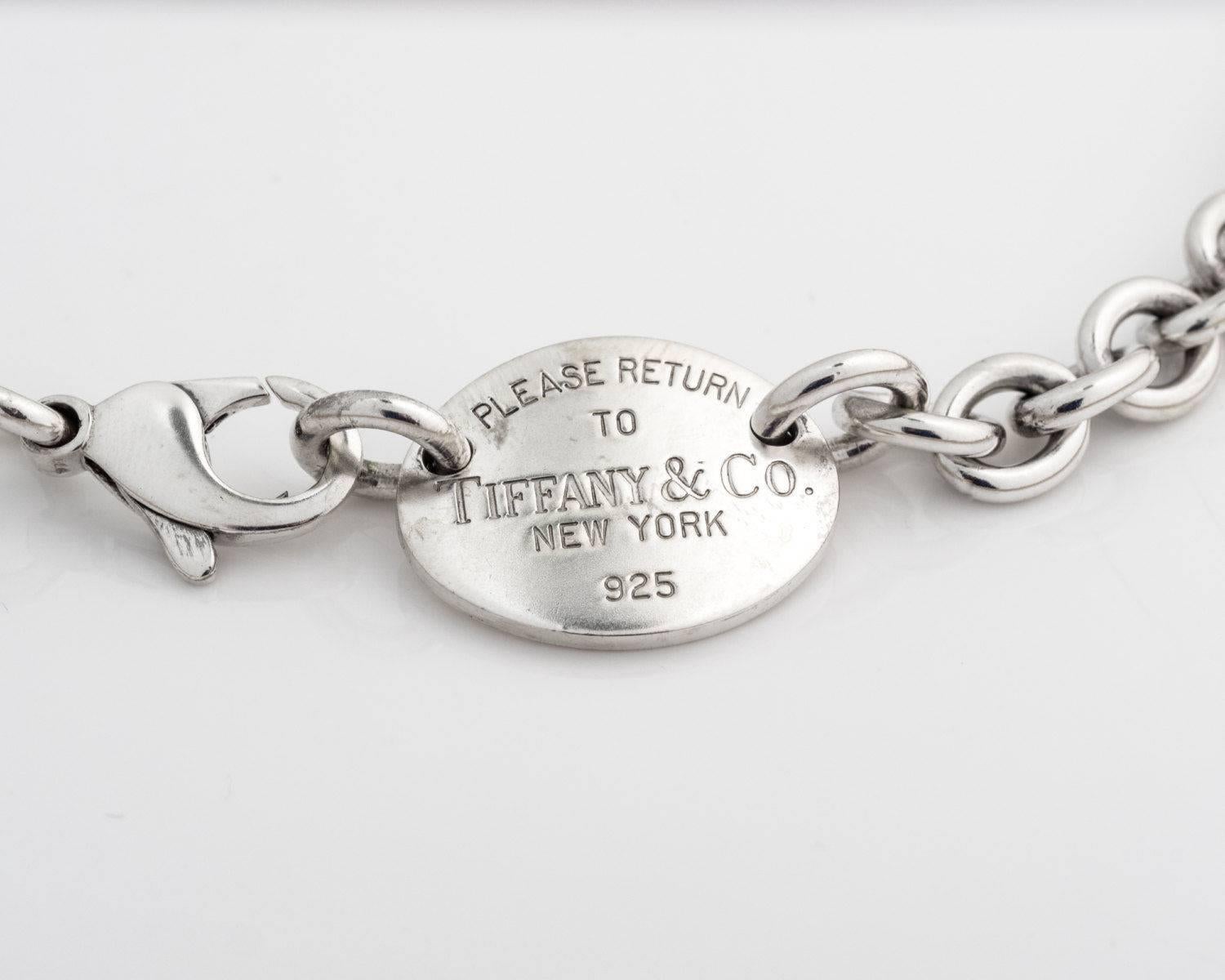 Tiffany & Co. Return to Tiffany Vintage Tag Pendant Sterling Silver Necklace

Features large, open Sterling Silver links. At one end of the link necklace is an oval tag, at the other is the clasp. The oval tag is engraved PLEASE RETURN TO TIFFANY &