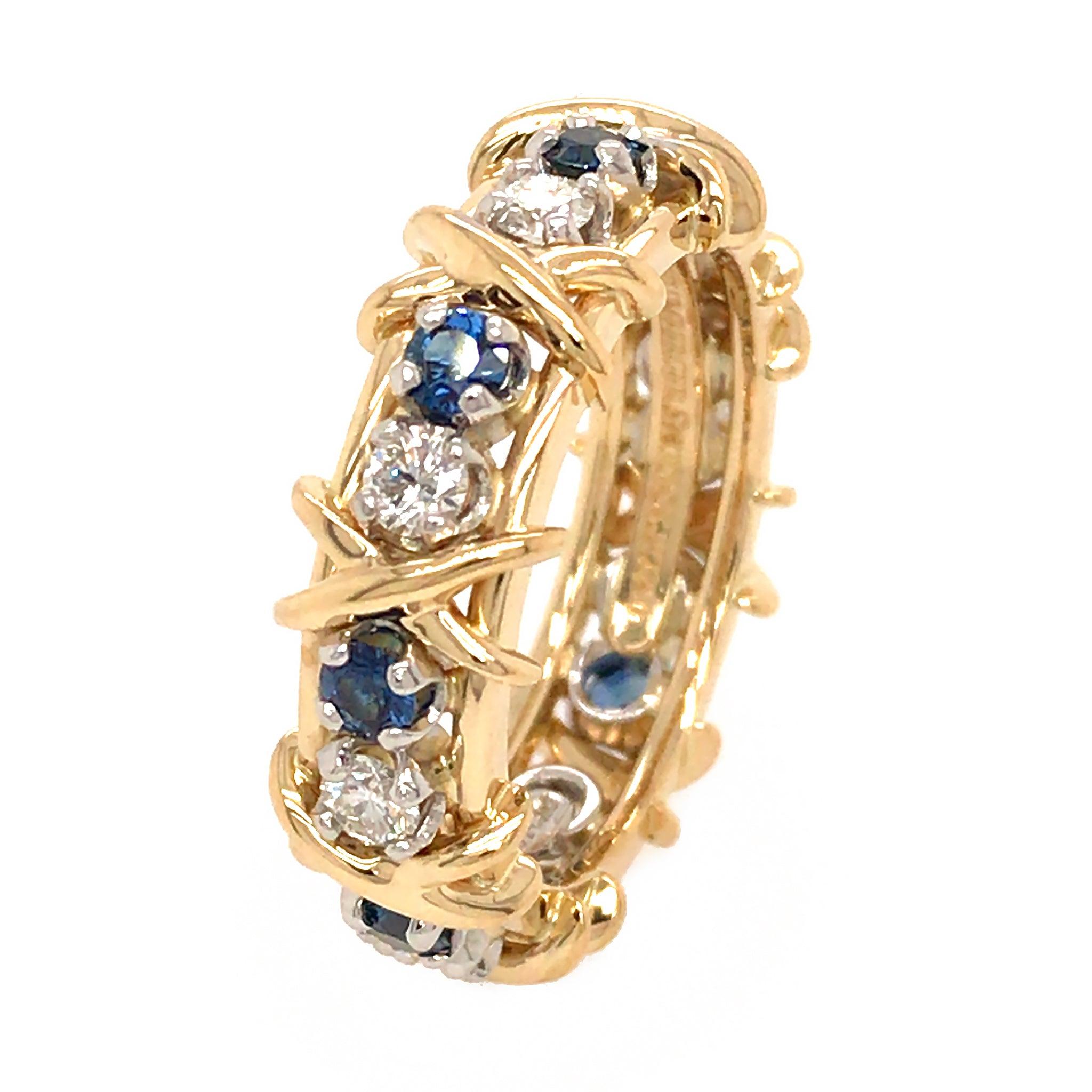 18kt Gelbgold und Platin
16 Steine = Saphir und Diamant
Gesamtgewicht 9,3 Gramm
Ringgröße: 6.75
Die Diamanten haben die Farben D, E und F. 
Neben jedem Diamanten befinden sich 8 runde natürliche blaue Saphire
Es wird mit einem Tiffany & Co.-Beutel