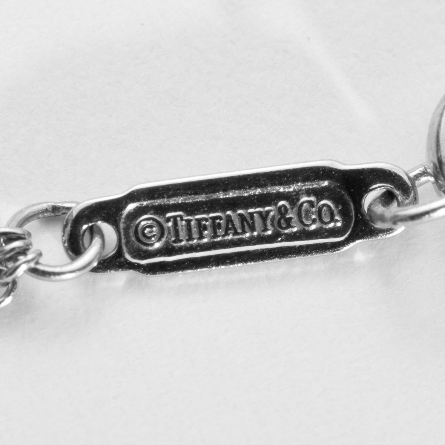 Tiffany and Co., Authentic Platinum and diamond multi-strand chain necklace, suspending five stars set with round brilliant-cut diamonds. Signed Tiffany & Co. 15.75