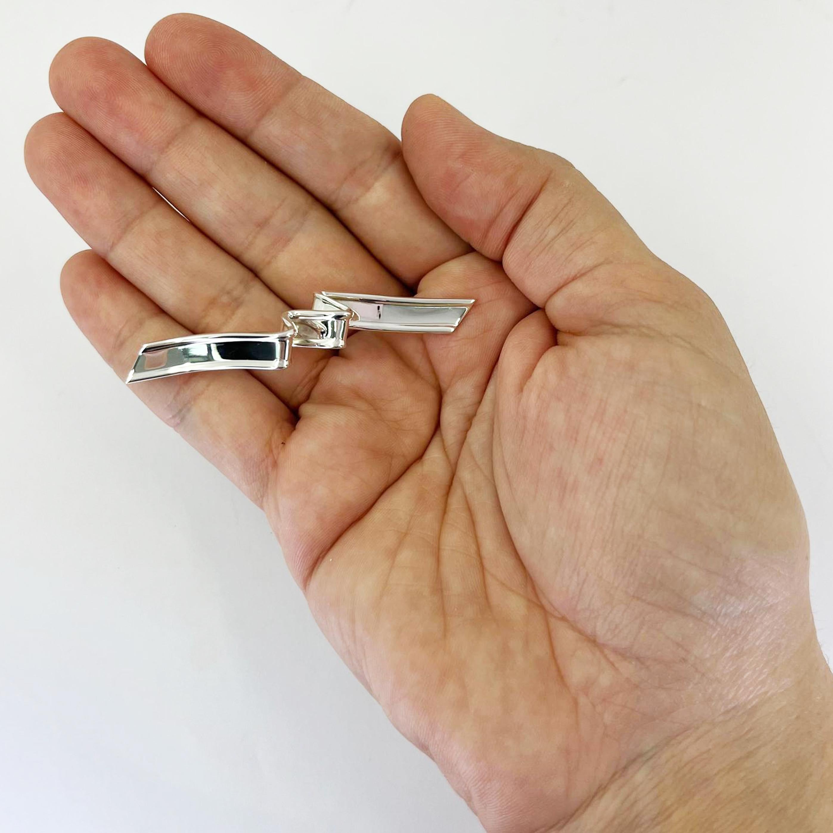 Tiffany and Co. sterling silver ribbon brooch measuring 2.5 inches long. $650 MSRP.