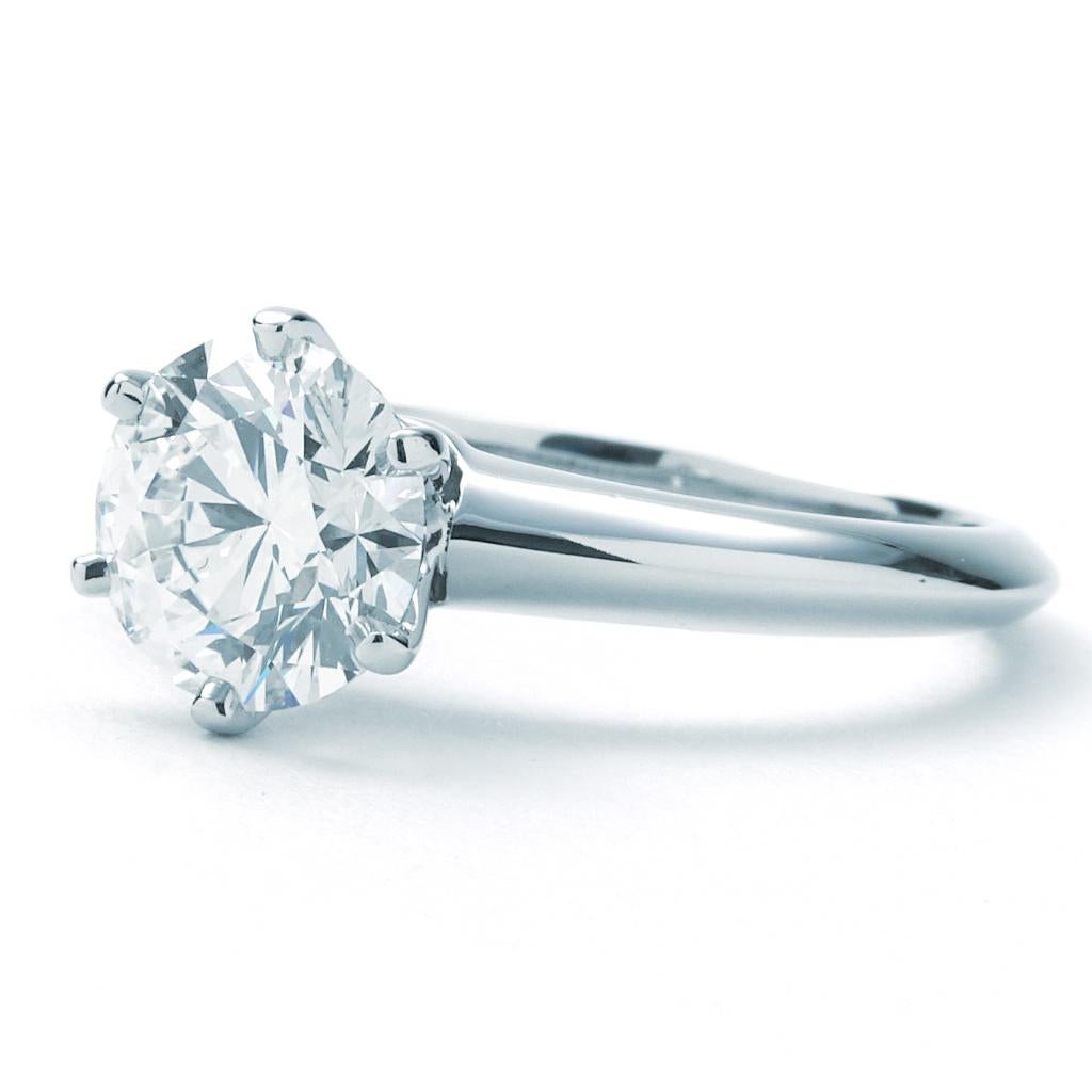 Previously-owned Tiffany & Co. Solitaire Collection ring. The ring is a size 4.25 (US), made of platinum, and weighs 2.90 DWT (approx. 4.51 grams). It also has one round H-color, VS2-clarity diamond weighing 1.42 CT. Comes in Tiffany & Co. Box.