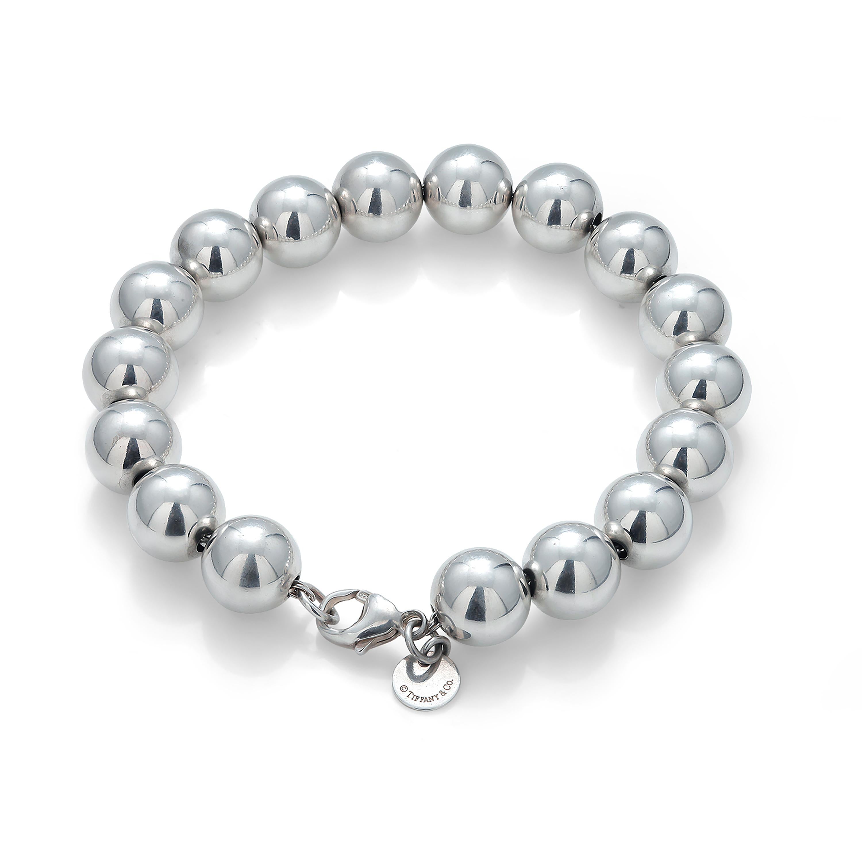 Tiffany & Co sterling silver bead 7 inch bracelet
Markings Tiffany & Co 925
Bracelet weighing 17.3 grams
Beads measuring 9.8 millimeter, 0.40 inch each
In excellent condition, like new
Designed to be comfortable and easy to wear
According to the