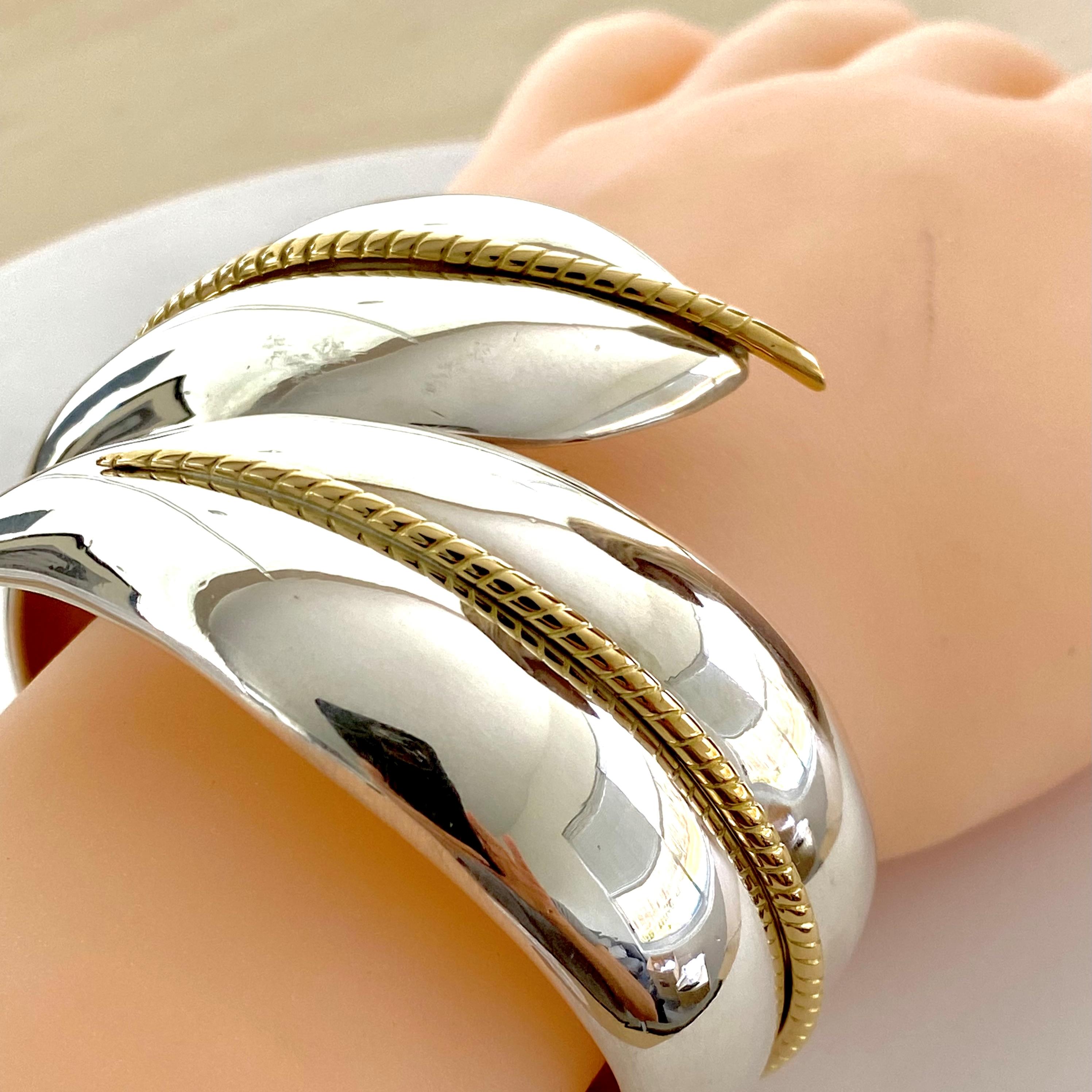 Tiffany and Co Sterling Silver and Eighteen Karat Gold Hinged Cuff Bracelet In Good Condition In New York, NY