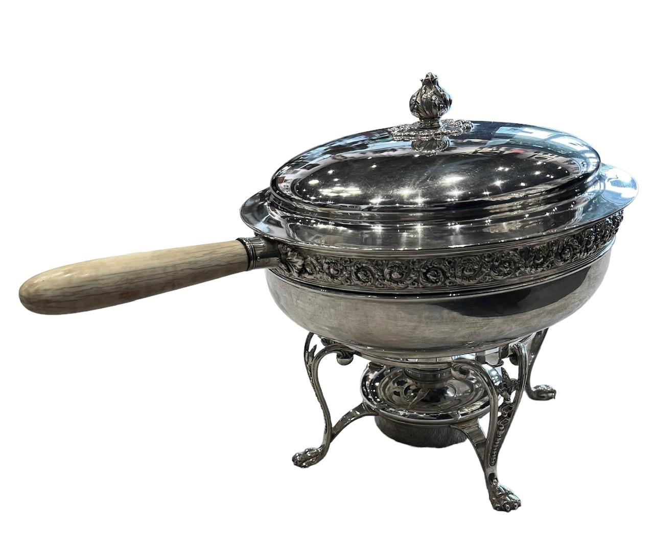 This exquisite Tiffany and Company sterling silver chafing dish, from New York, represents a timeless piece of culinary history. It showcases the renowned pattern 11079, a design that first graced dining tables in 1891, making it a treasured relic