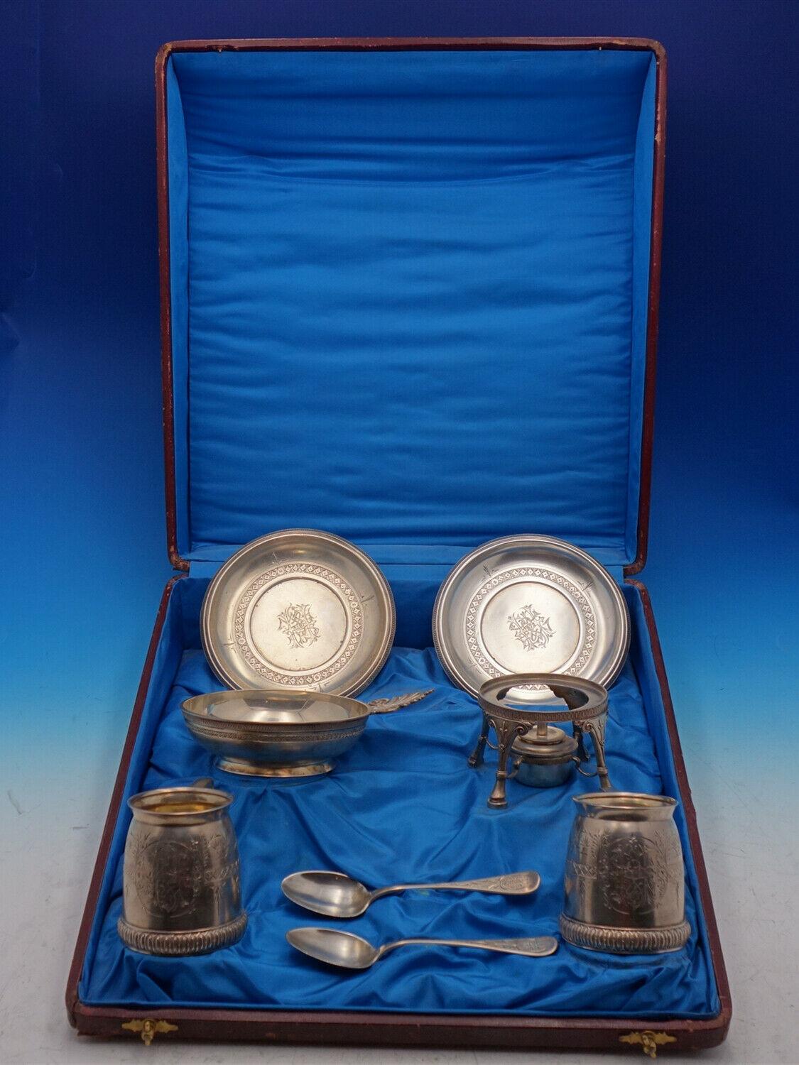 Tiffany and Co

Amazing Tiffany and Co sterling silver child's 8-piece set dated 1872 in massive presentation box with blue satin lining (measures 17 1/2