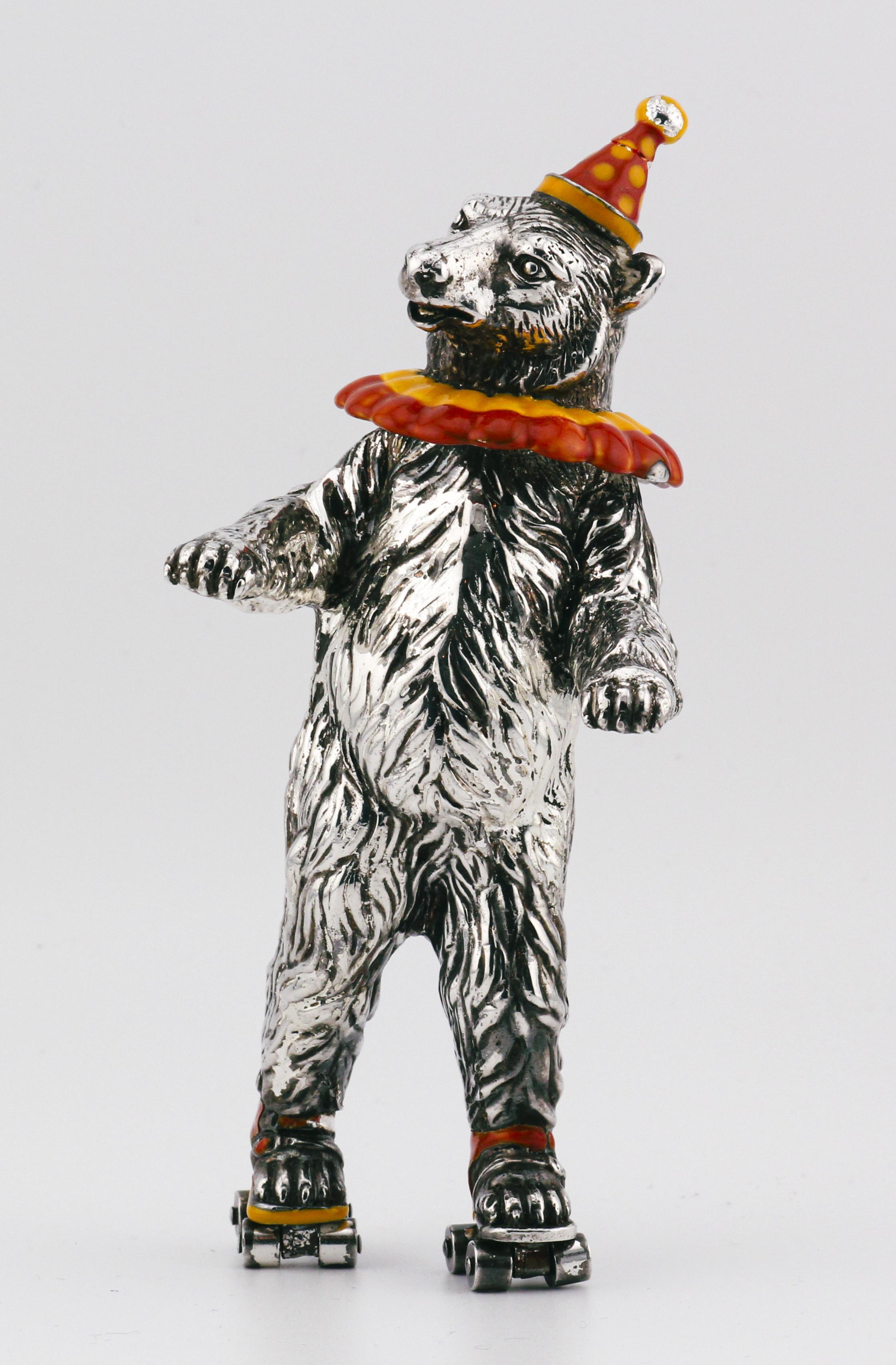 Immerse yourself in a world of enchantment with the Tiffany and Co. Sterling Silver Enamel Circus Bear on Roller Skates Figurine, a delightful embodiment of whimsy and charm. Crafted by the esteemed luxury brand Tiffany and Co., this captivating