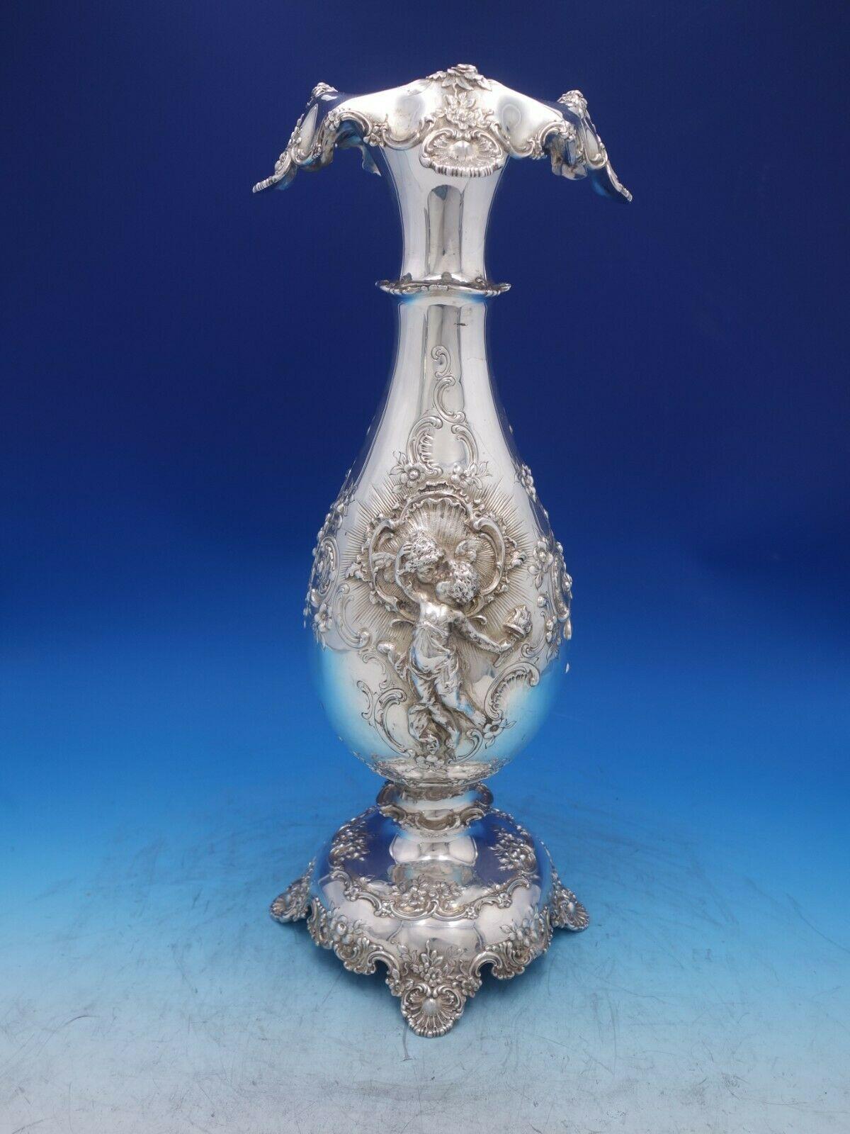 Tiffany and Co.

Magnificent pair of antique Tiffany and Co. large vases with 3-dimensional applied cupids in fine detail playing instruments and painting. The detail is incredible. The vases also have beautiful rococo and repousse detailing. They