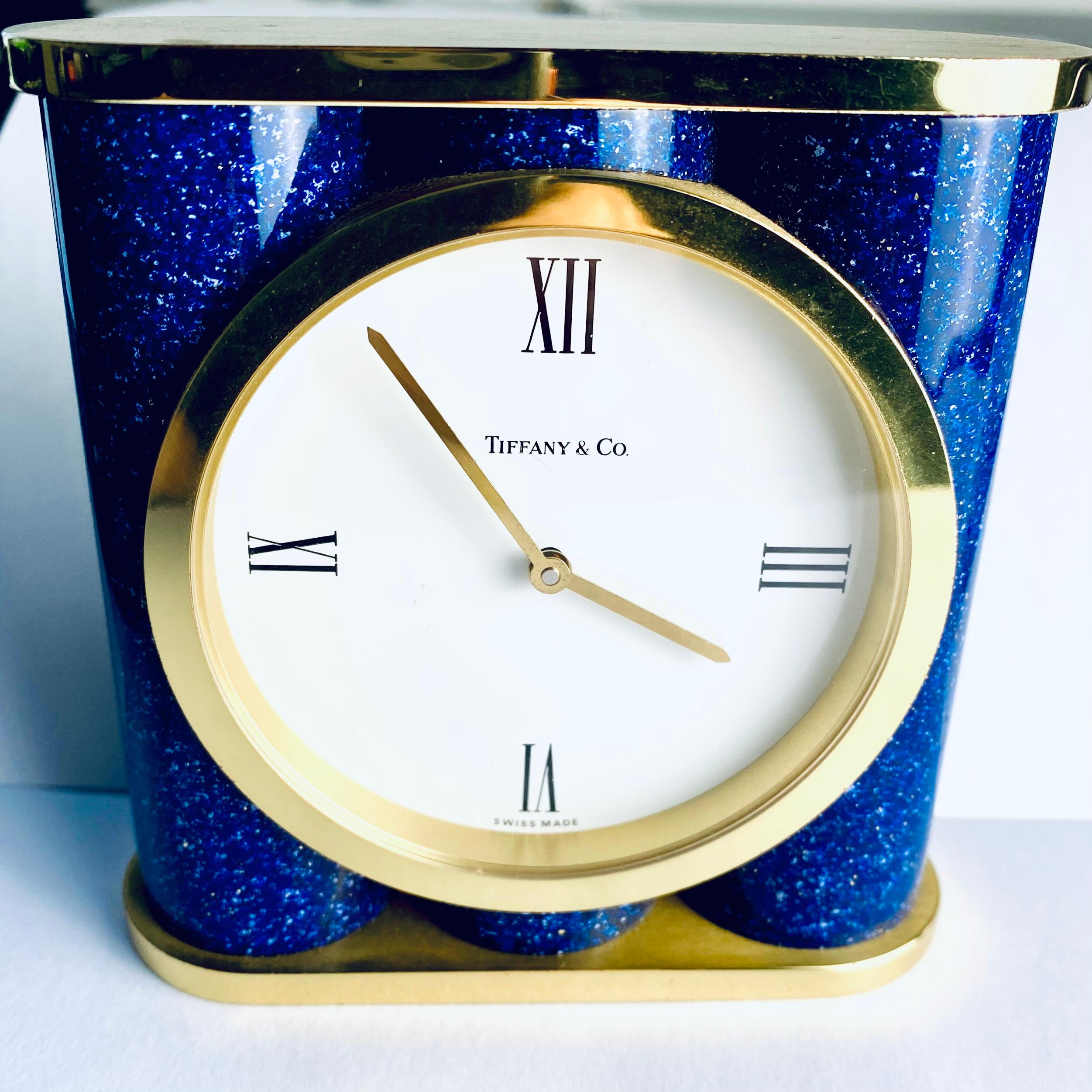 An Exquisite Late 20th-Century Masterpiece

Elevate your space with this remarkable Swiss brass desk timepiece, retailed by Tiffany & Co. in the late 20th century. This elegant clock is a testament to timeless design and impeccable craftsmanship,