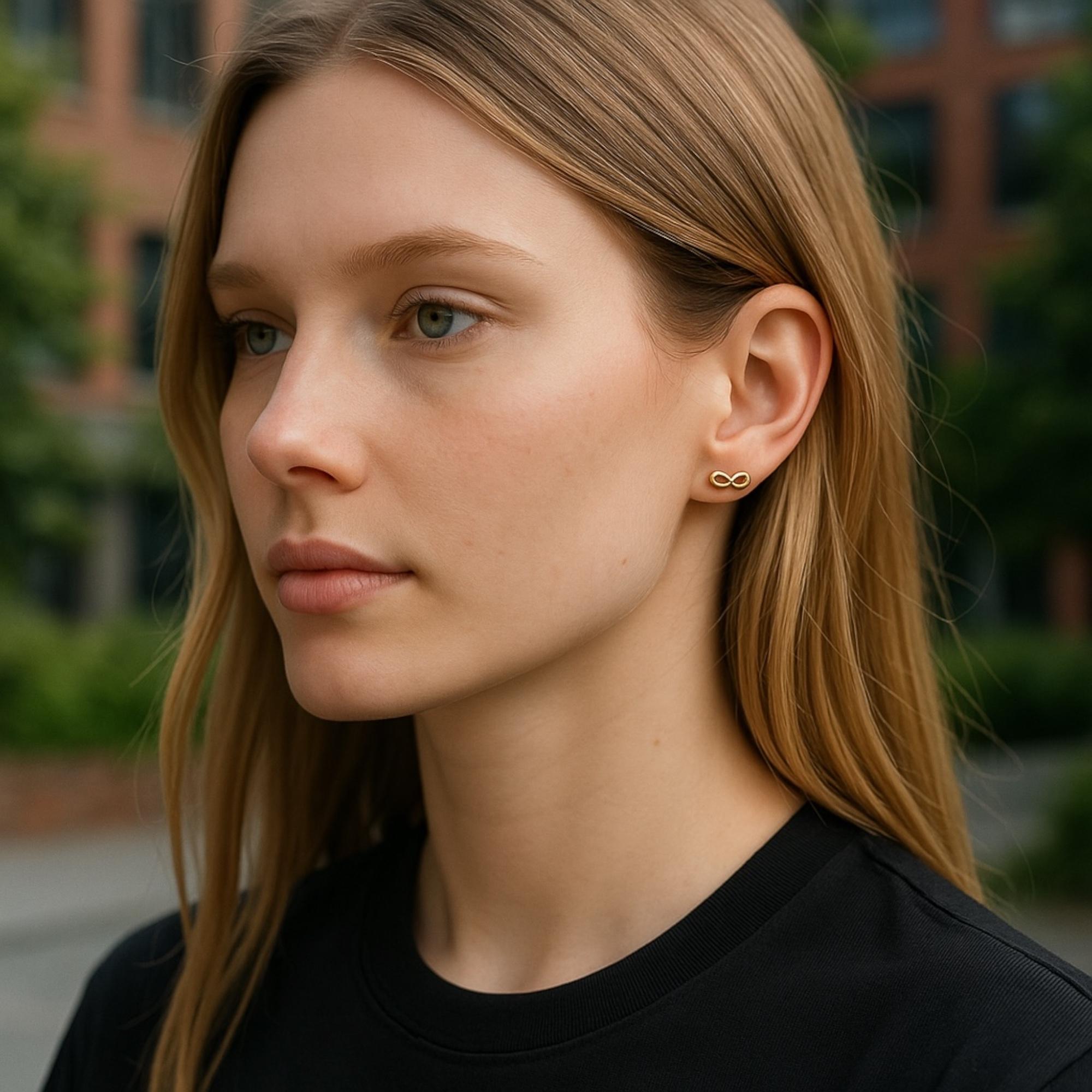Timeless Elegance in Petite Proportions  Signature Tiffany Style  Perfect Gift of Everlasting Love

Celebrate enduring elegance with these Vintage Tiffany & Co. Mini Infinity Stud Earrings, finely crafted in 18K yellow gold and bearing the iconic