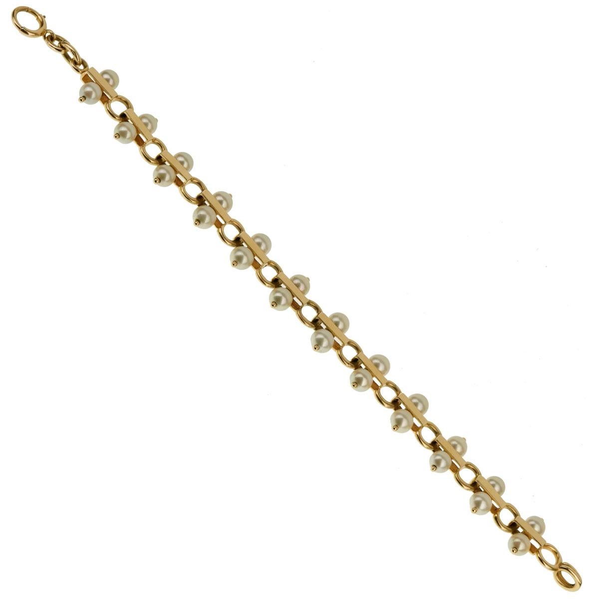 An fabulous vintage Tiffany & Co pearl bracelet set in 14k yellow gold. The bracelet measures .62