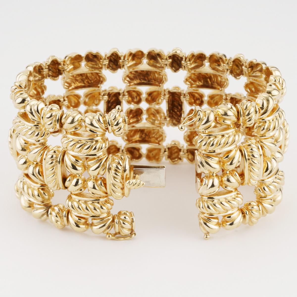 Previously-owned vintage Tiffany & Co. wide bracelet. The bracelet is 44.5mm wide, 7 inches in length, made of 18K yellow gold, and weighs 109.90 DWT (approx. 170.91 grams).