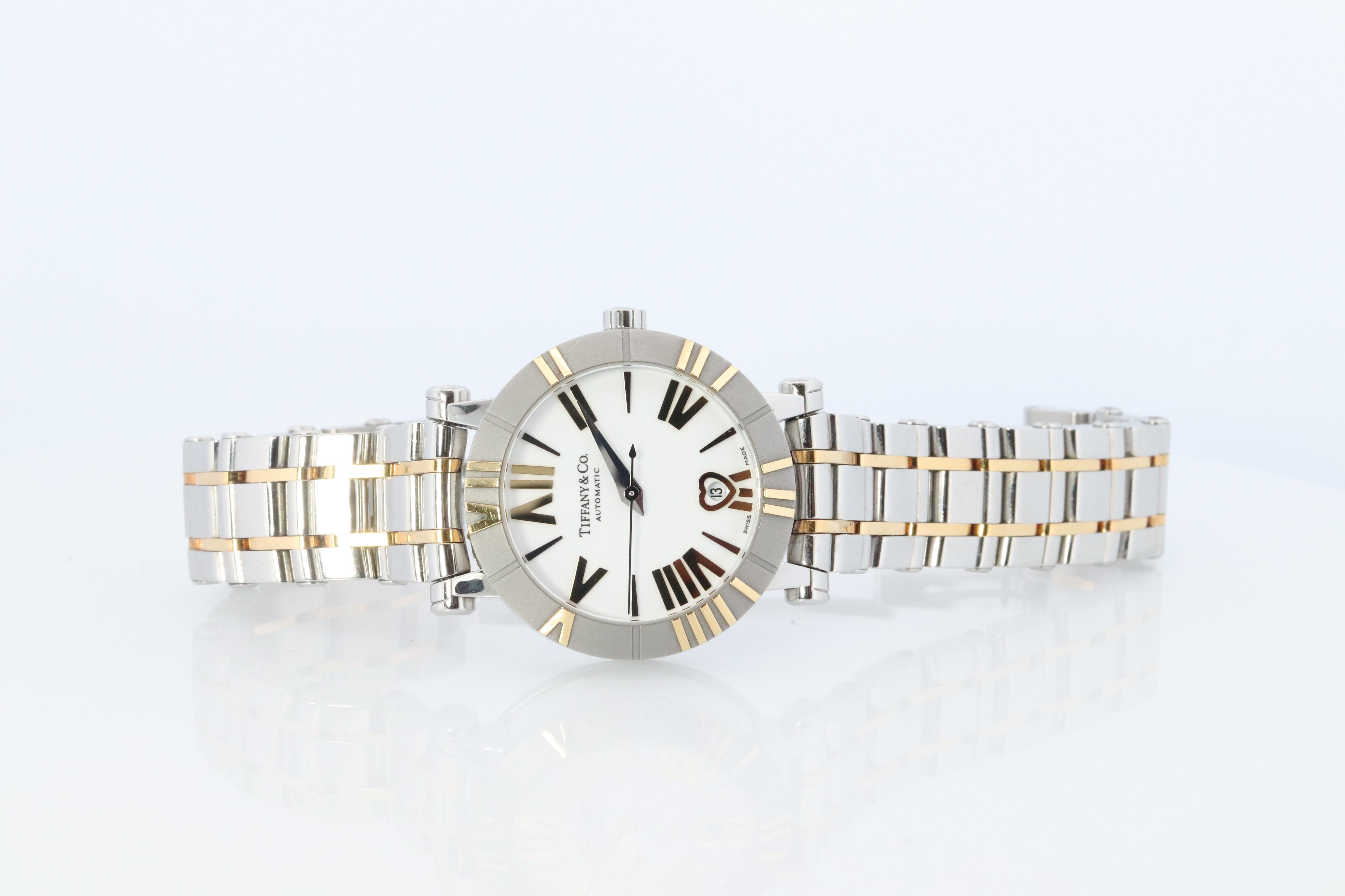 Tiffany and Co Atlas Watch
Automatic Movement


18k Gold with Stainless Steel with White Ceramic
30mm case

Beautiful Ladies Watch.

Transparent back. Beautiful Moement.


Condition: Excellent Condition

6.5in wrist.