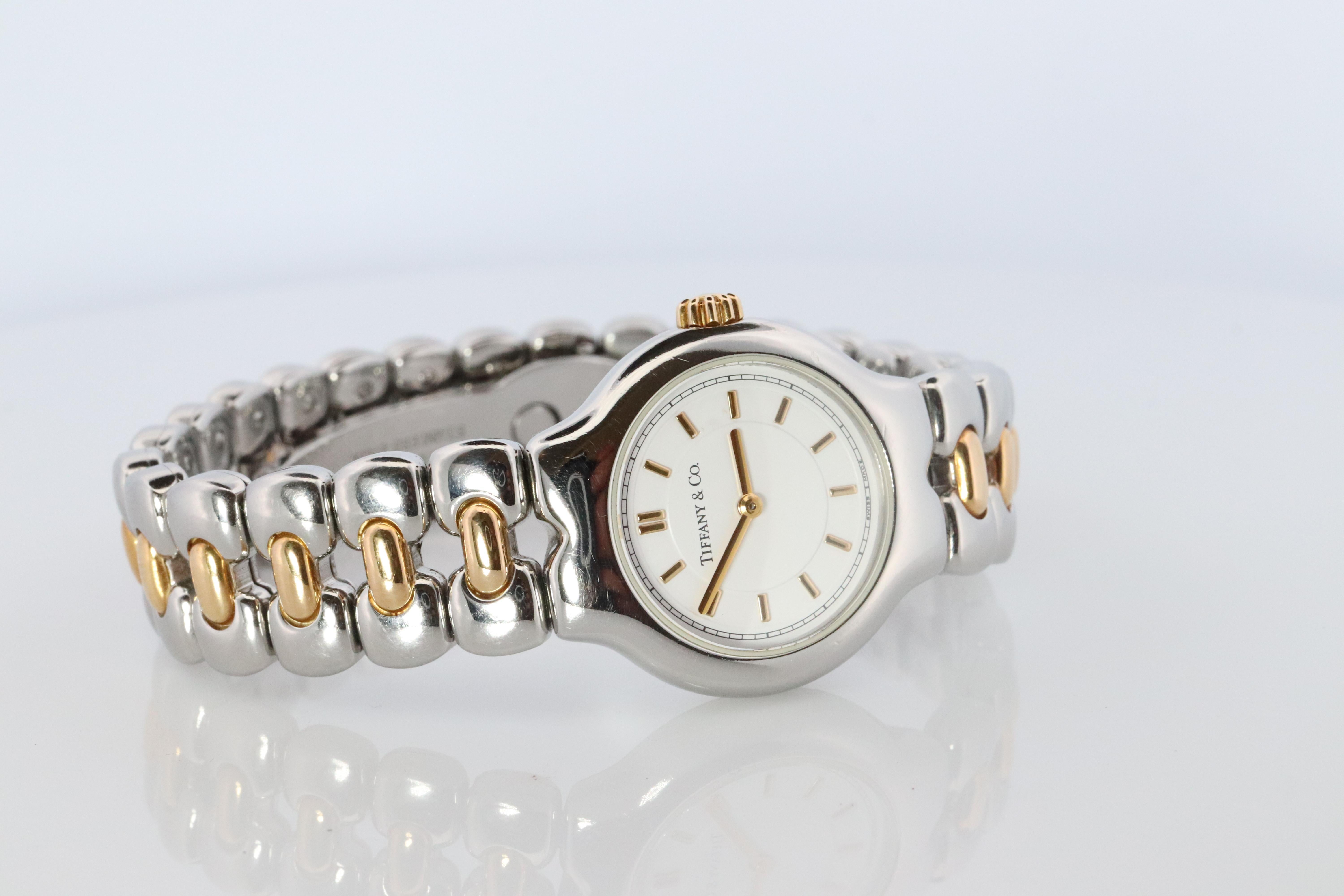 RARE Tiffany and Co Tessoro Watch
L0112

18k Gold with Stainless Steel
25mm case

Beautiful Watch. Quartz. Works and keeps time. New Battery installed.

Comes with original Tiffany Watch box.

Condition: Limited visible signs of wear.