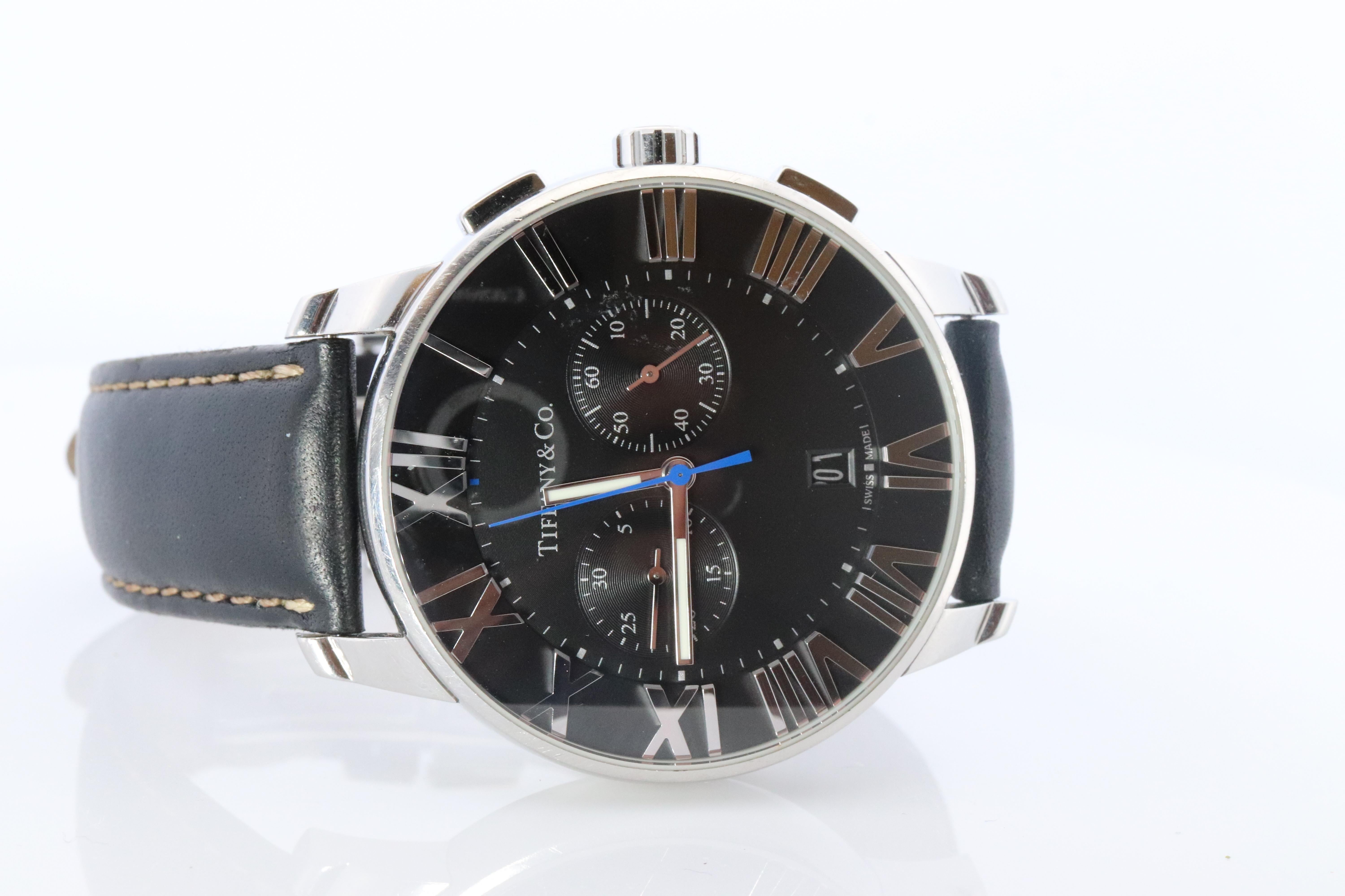 Tiffany and Co Atlas Watch
Atlas Dome Chronograph

Stainless Steel with Black Leather.
42mm case

Stunning Movement.

Condition: Has some wear to the leather band. Serviced with new Tiffany Movement.