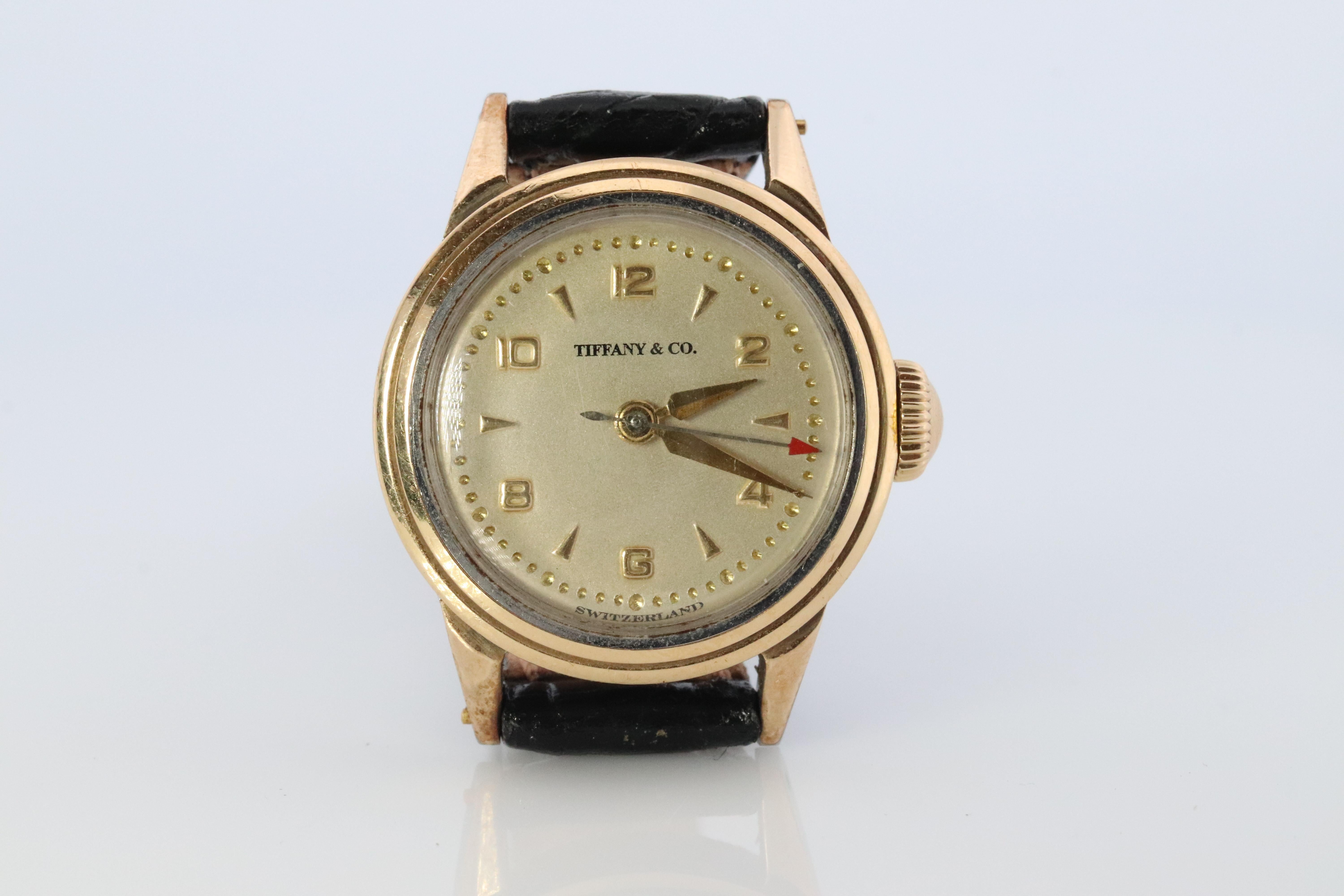 RARE Tiffany and Co and Movado Ladies Watch.

Ref. 11902

Gold Cap Case. 17j 1460 Caliber Movado watch.

Womens Stainless Steel 24mm case.

Beautiful Watch. Mechanical. Works and keeps time.

New Black Leather Band.

Condition: 1950s.