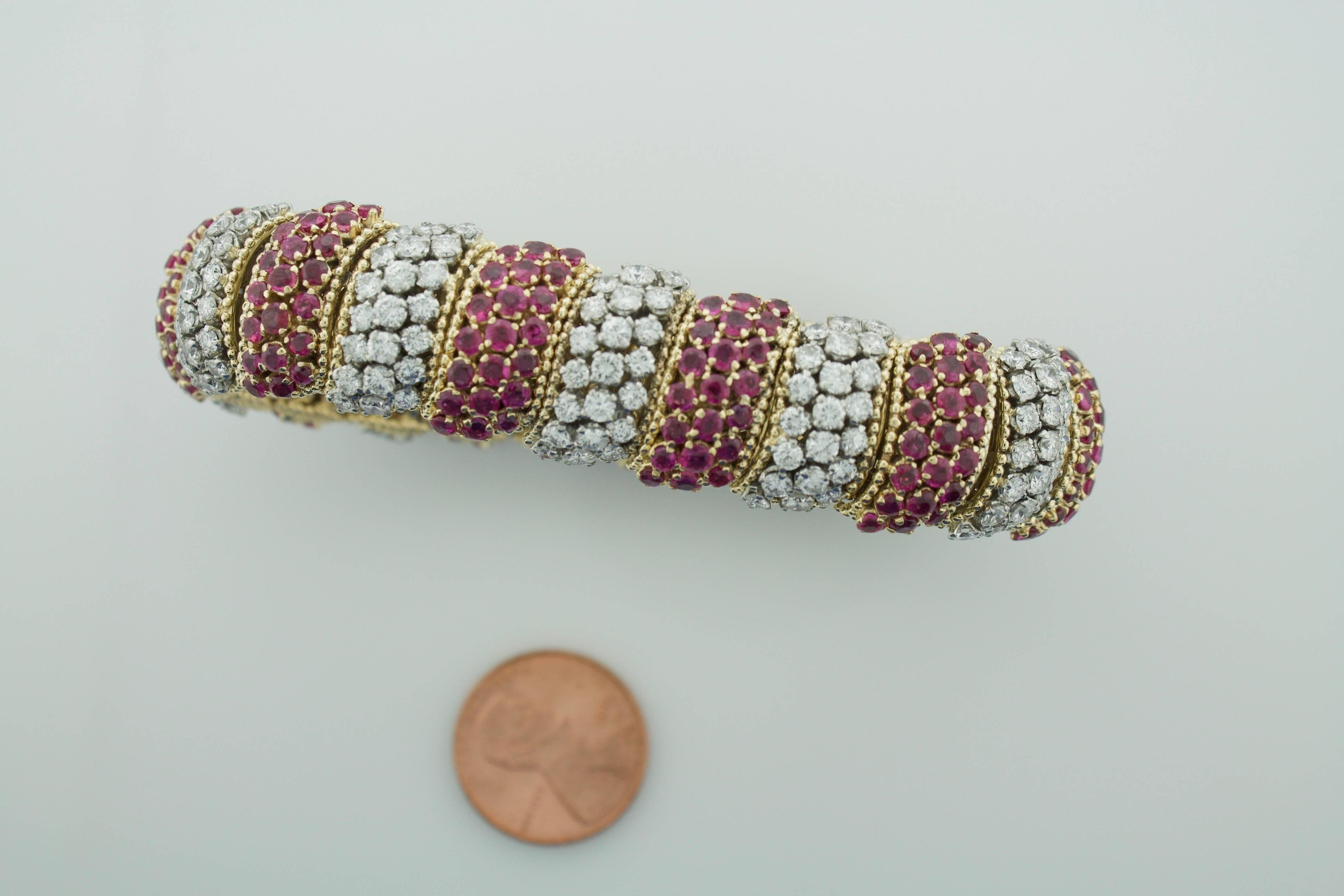 Tiffany and Company 18k Yellow Gold Diamond and Ruby Bracelet circa 1950's
231 Round Brilliant Cut Diamonds Weighing 10.40 carats (approximately)
231 Round Rubies Weighing 12.50 carats (approximately)
Engraved: Tiffany & Co. ITALY 18k 750