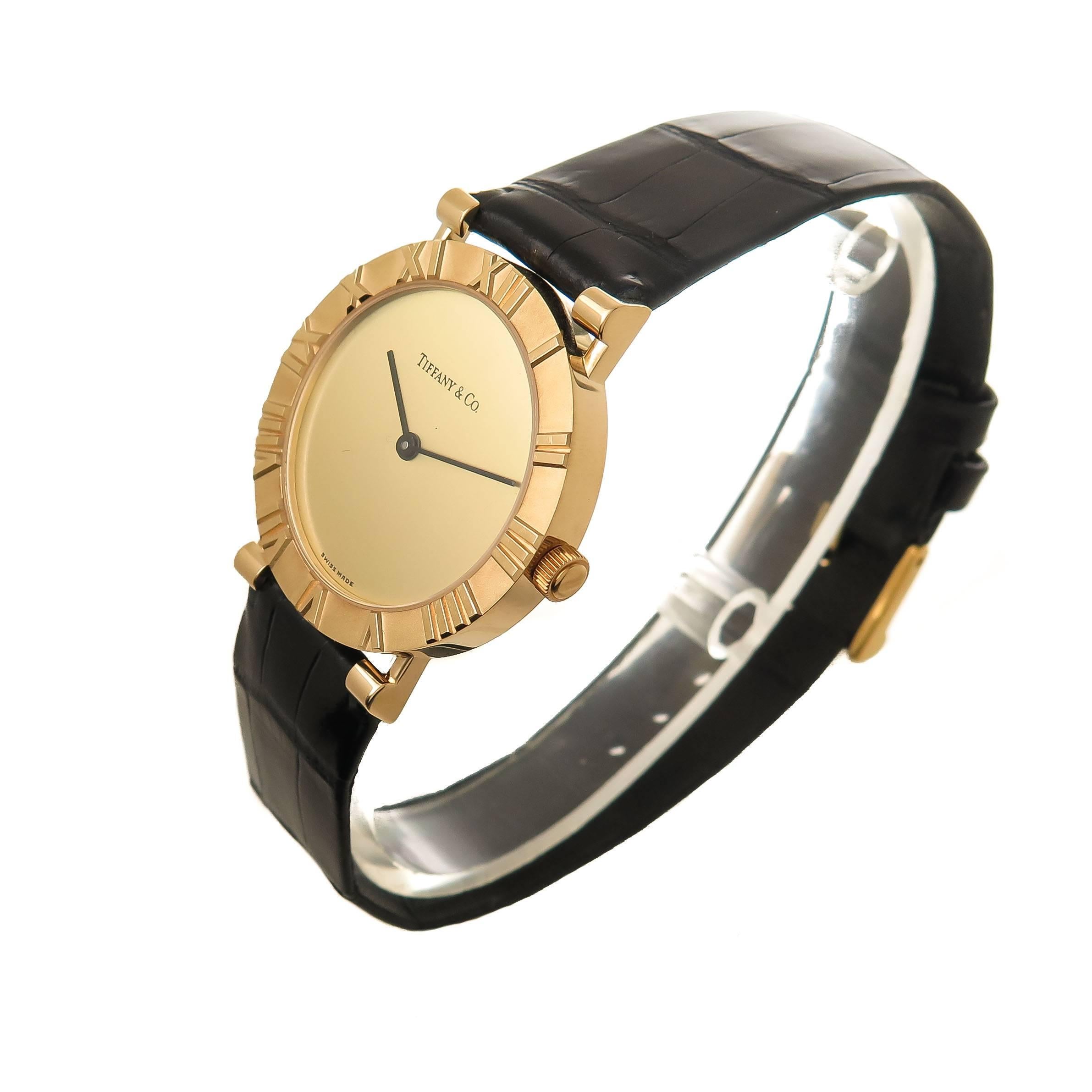 Circa 2000 Tiffany & Company Atlas Collection Wrist watch, 31 M.M. 18K Yellow Gold Water resistant case. Quartz Movement, Gold dial. Original Tiffany & Company Black Alligator strap with Tiffany Buckle, watch length 9 1/4 inches.. Original Tiffany