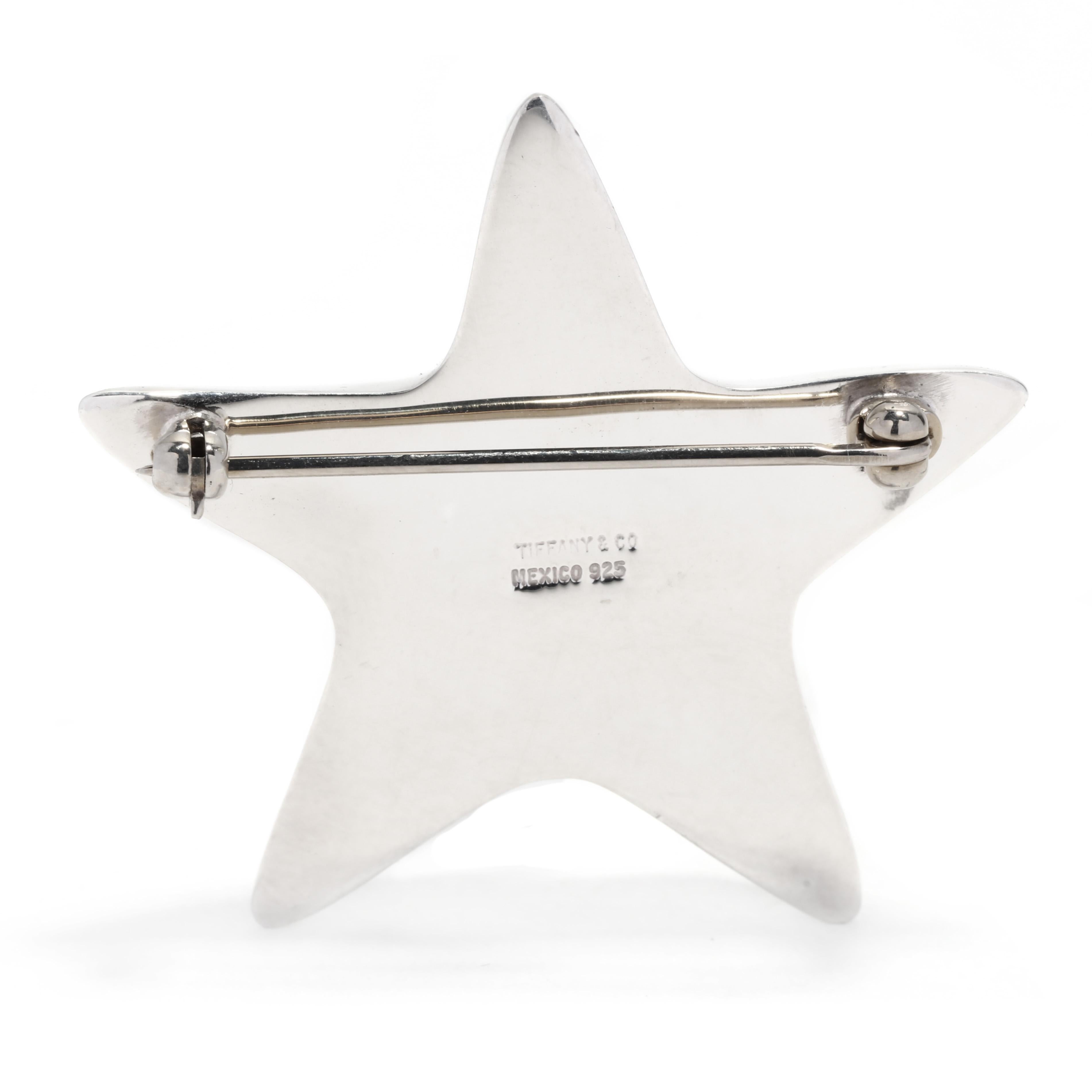 A vintage Tiffany and Company Mexican sterling silver star brooch. This large star brooch features a puffed design of a five point star with a pin stem and C clasp.

Length: 1.5 in.

Width: 1.5 in.

Weight: 7.7 dwts. / 12 grams

Stamps: TIFFANY & CO