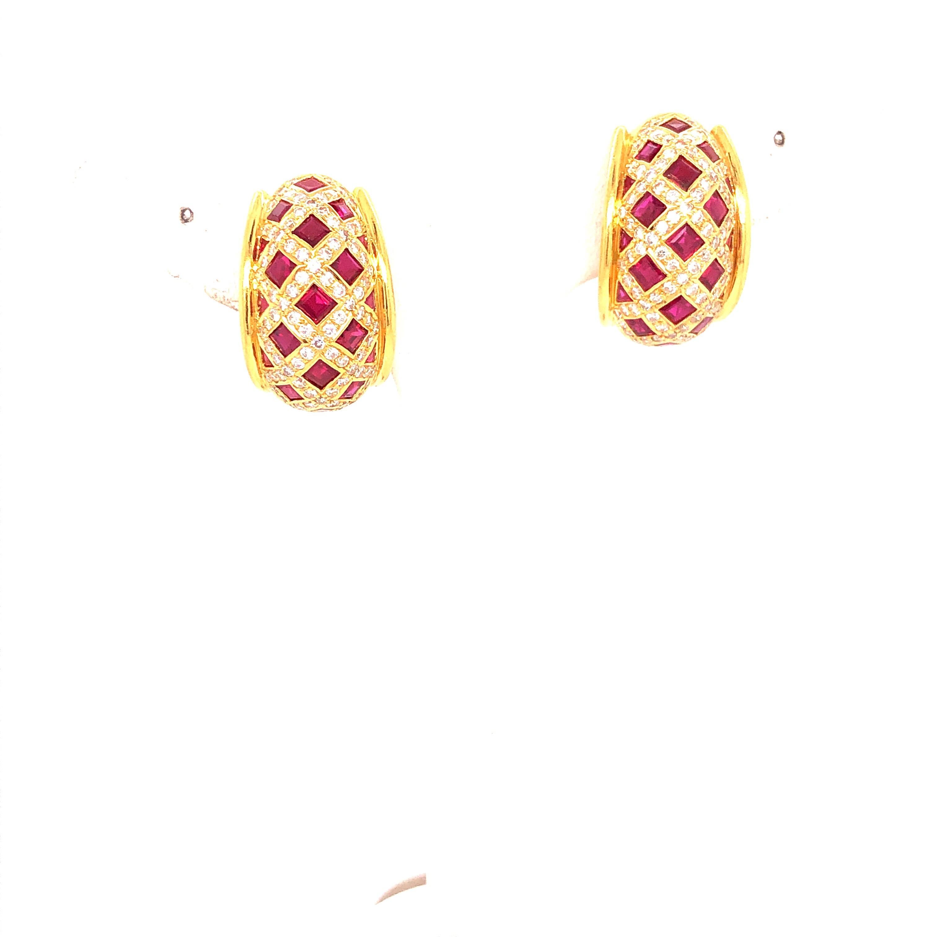 18K Yellow Gold Tiffany Company Ruby and Diamond Earrings.  These stunning earrings are Clip On.  Stamped T and C and 750.  Rubies are square shaped and calibre cut and Diamonds are Round.  Thirty six total rubies.