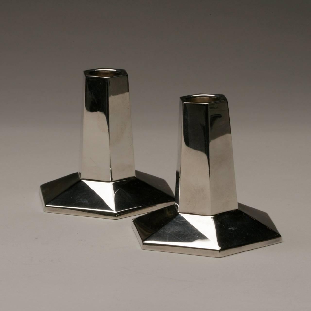 Tiffany and Company sterling silver candlesticks by Frank Lloyd Wright.

Original design by Frank Lloyd Wright, Tiffany also made these in lead crystal.

This pair was specially commissioned and made in Italy for Tiffany for a VIP customer.