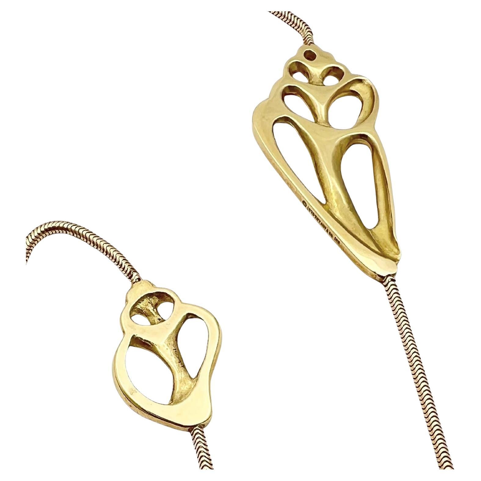Schlangenkette mit sieben goldenen Muschelfragmenten aus 18 Karat Gelbgold von Angela Cummings für Tiffany & Co.  Mit einer Gesamtlänge von 30 Zoll sind die Muschelmuster flach und poliert und an verschiedenen Stellen mit der glatten Schlangenkette