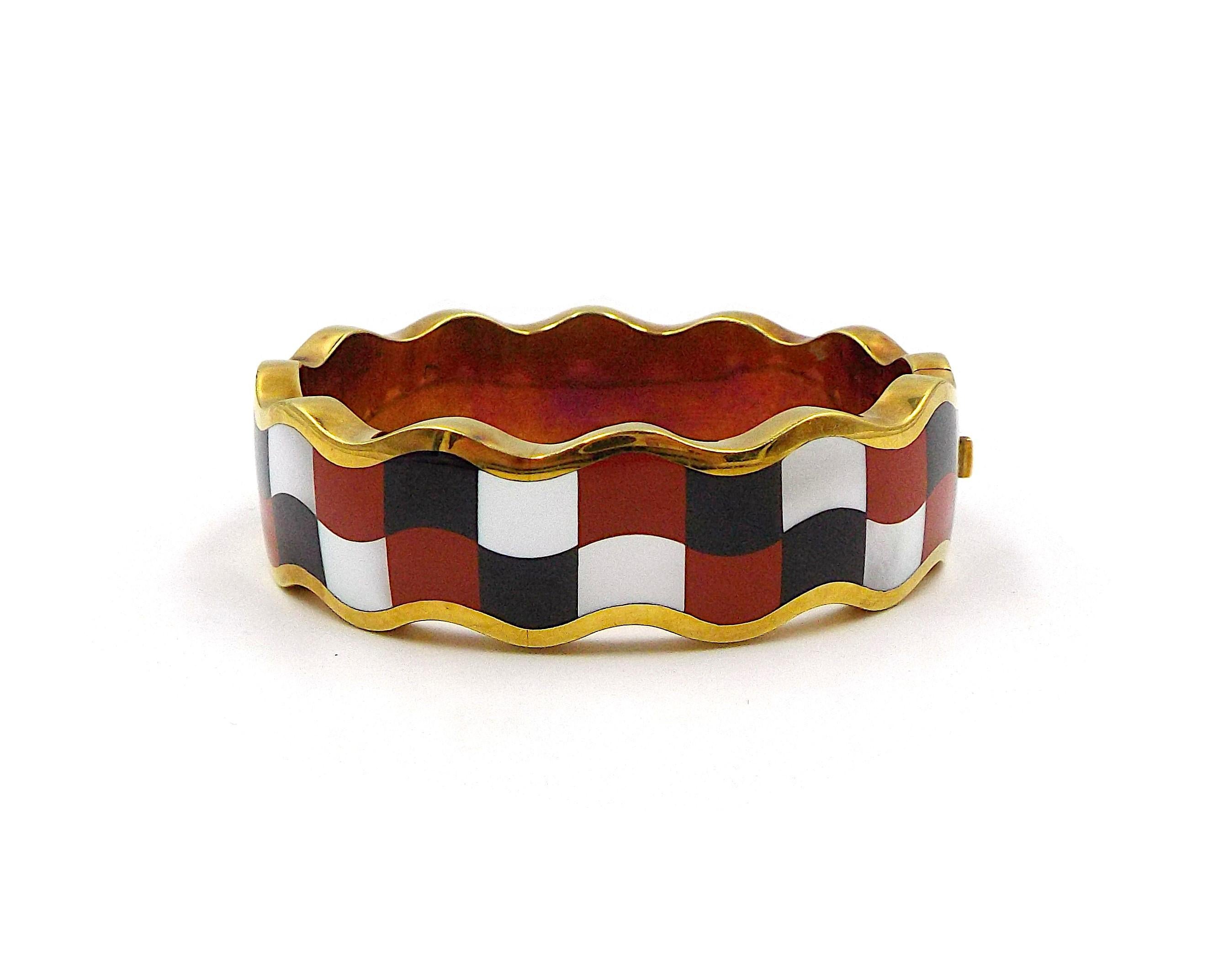 A stylish bangle bracelet by Angela Cummings for Tiffany featuring chess board pattern made of jasper, onyx and mother-of-pearl square-shaped stones. Signed Tiffany, with maker's marks, marked 750, 18K. Inner circumference is approximately 6.5