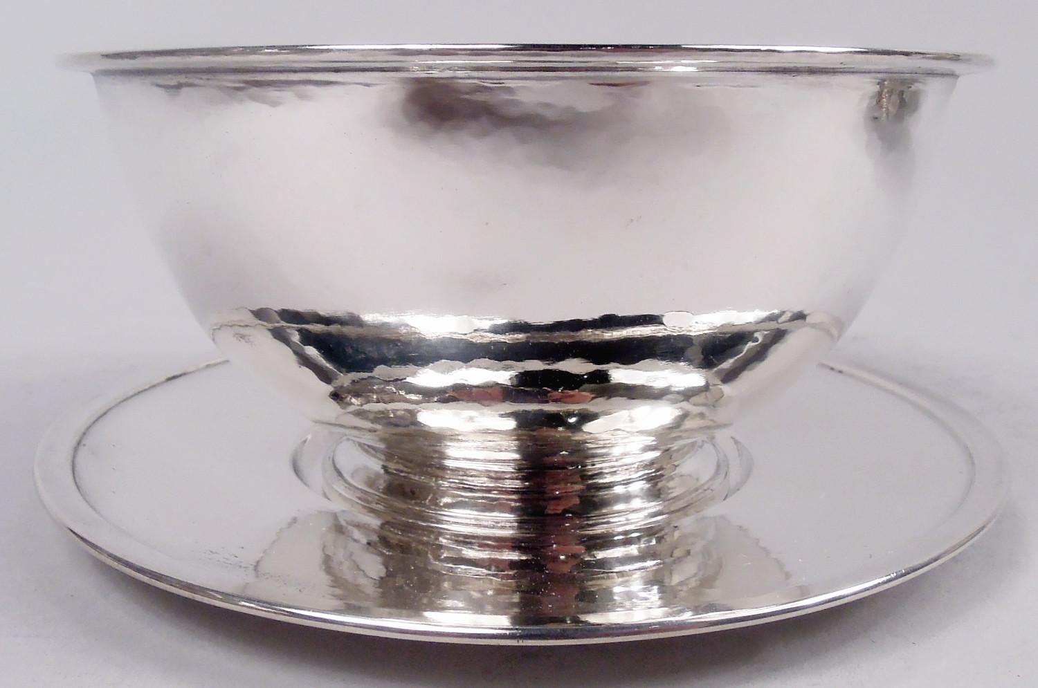 Art Deco Craftsman sterling silver dessert set. Made by Tiffany & Co. in New York, ca 1920. This set comprises eight bowls and eight plates. Each bowl: Curved with flat stepped rim and stepped foot. Each plate: Round well, wide shoulder, and flat