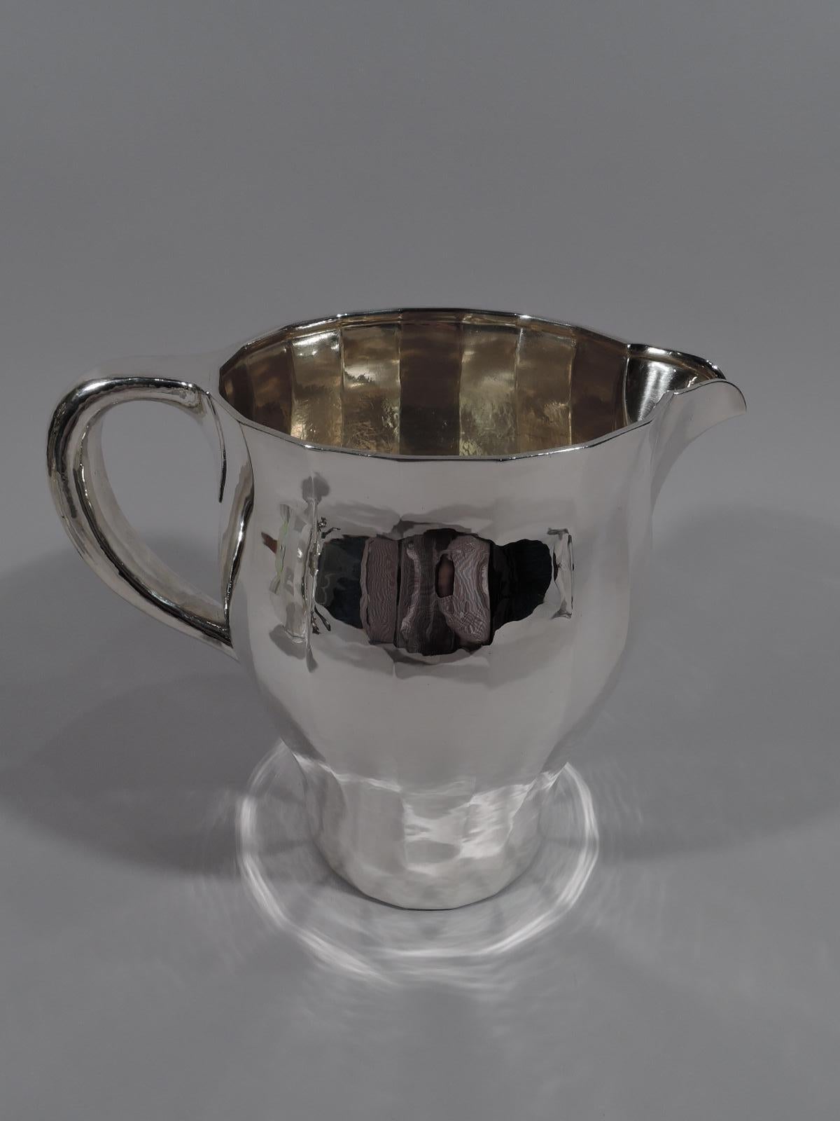 Art Deco craftsman sterling silver drinks set. Made by Tiffany & Co. in New York, circa 1915. This set comprises pitcher, 4 tumblers, and tray. The pitcher and tumblers have gentle baluster form. The pitcher has a c-scroll handle and curvilinear