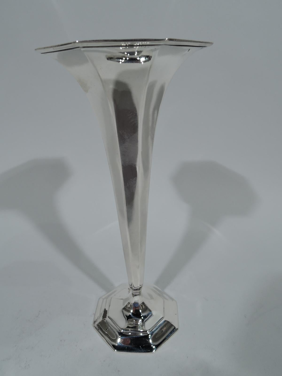 Art Deco sterling silver bud vase. Made by Tiffany & Co. in New York. Faceted cone with flared and molded octagonal mouth. Foot stepped and octagonal. Small-scale modernism for one simple blossom. Hallmark includes pattern no. 18375 (first produced