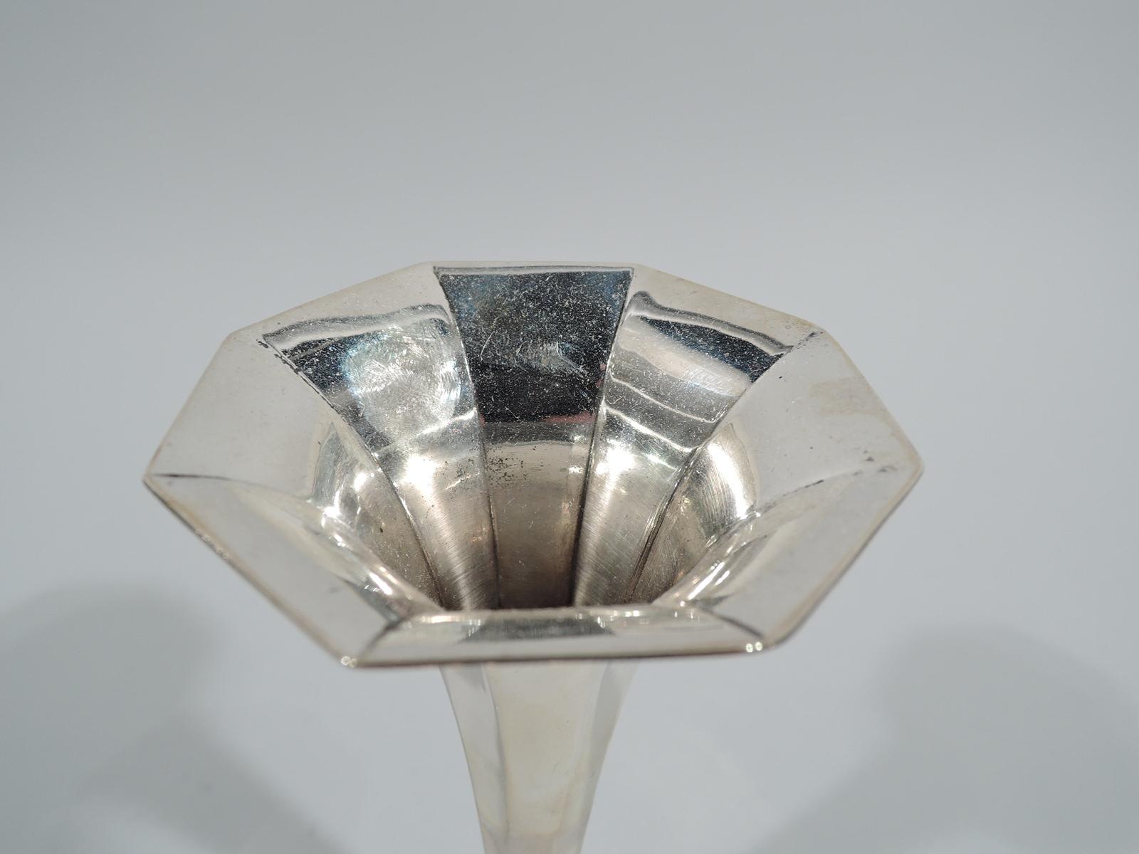 Art Deco sterling silver bud vase. Made by Tiffany & Co. in New York, circa 1912. Faceted cone with flared and molded octagonal mouth. Foot stepped and octagonal. Small-scale modernism for one simple blossom. Fully marked including pattern no. 18375
