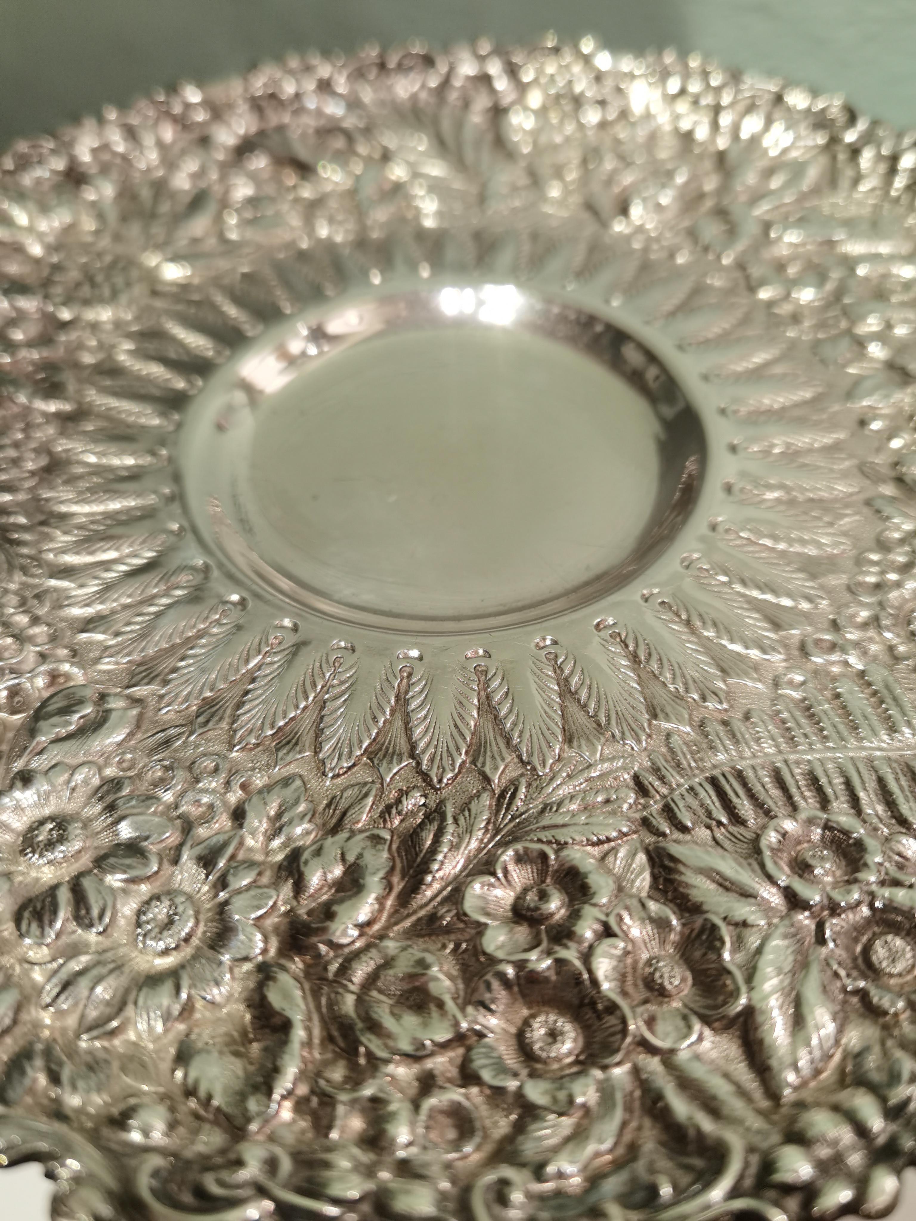 Tiffany Art Nouveau centerpiece bowl in sterling silver. The plate and the stand are rich handcrafted and decorated with fruits and leaves and blossoms.
Stamped inside Tiffany with modelnr B34. Ca 530 gram.