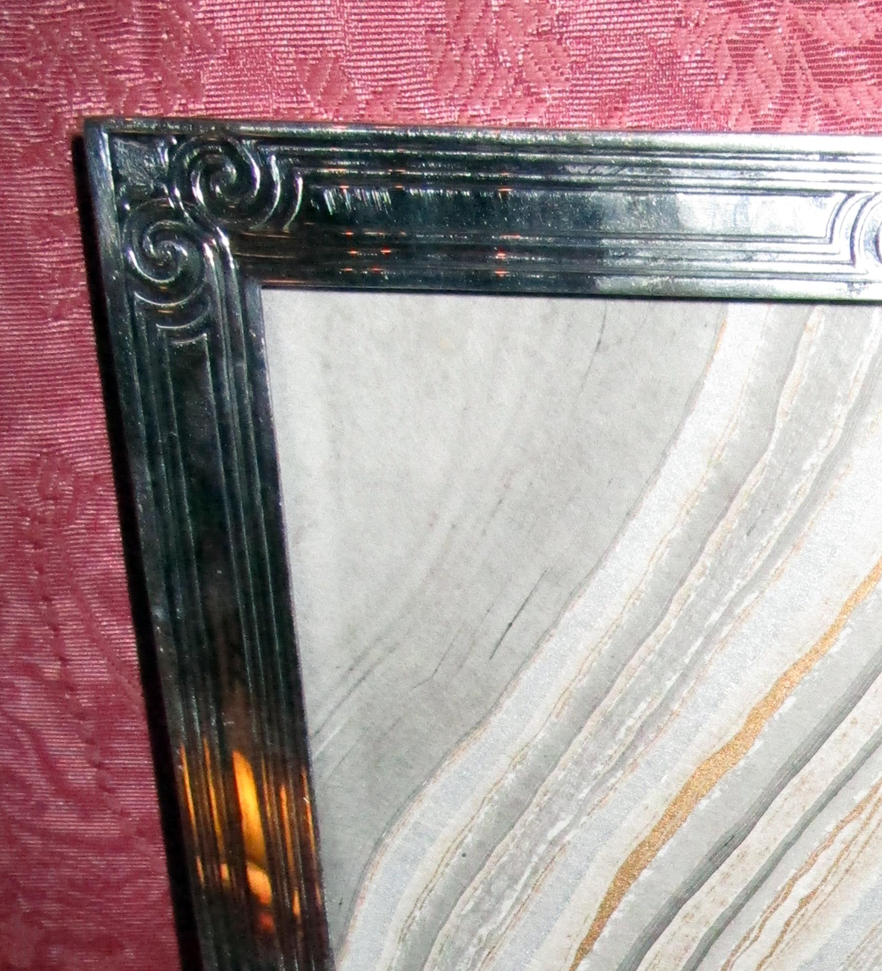 Art Deco sterling silver picture frame signed Tiffany & Co., New York. Rectangular window with acid-etched surround and sides. Marked Tiffany & Co. 16544S (pattern number), Makers 3002, sterling silver 925/1000 M (directors letter 1907-47.) Two