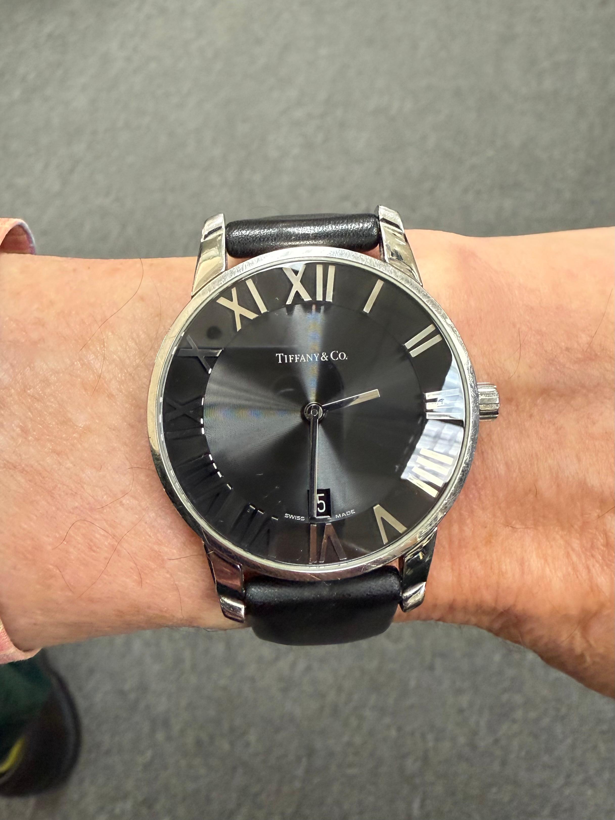 Tiffany Atlas Stainless Steel Large Wristwatch Large Size.

The Tiffany Atlas Stainless Steel Large Wristwatch from around 2000, is housed with a quartz movement.  Very elegant and sleek, the large case is over 37mm in diameter.  It's accompanied