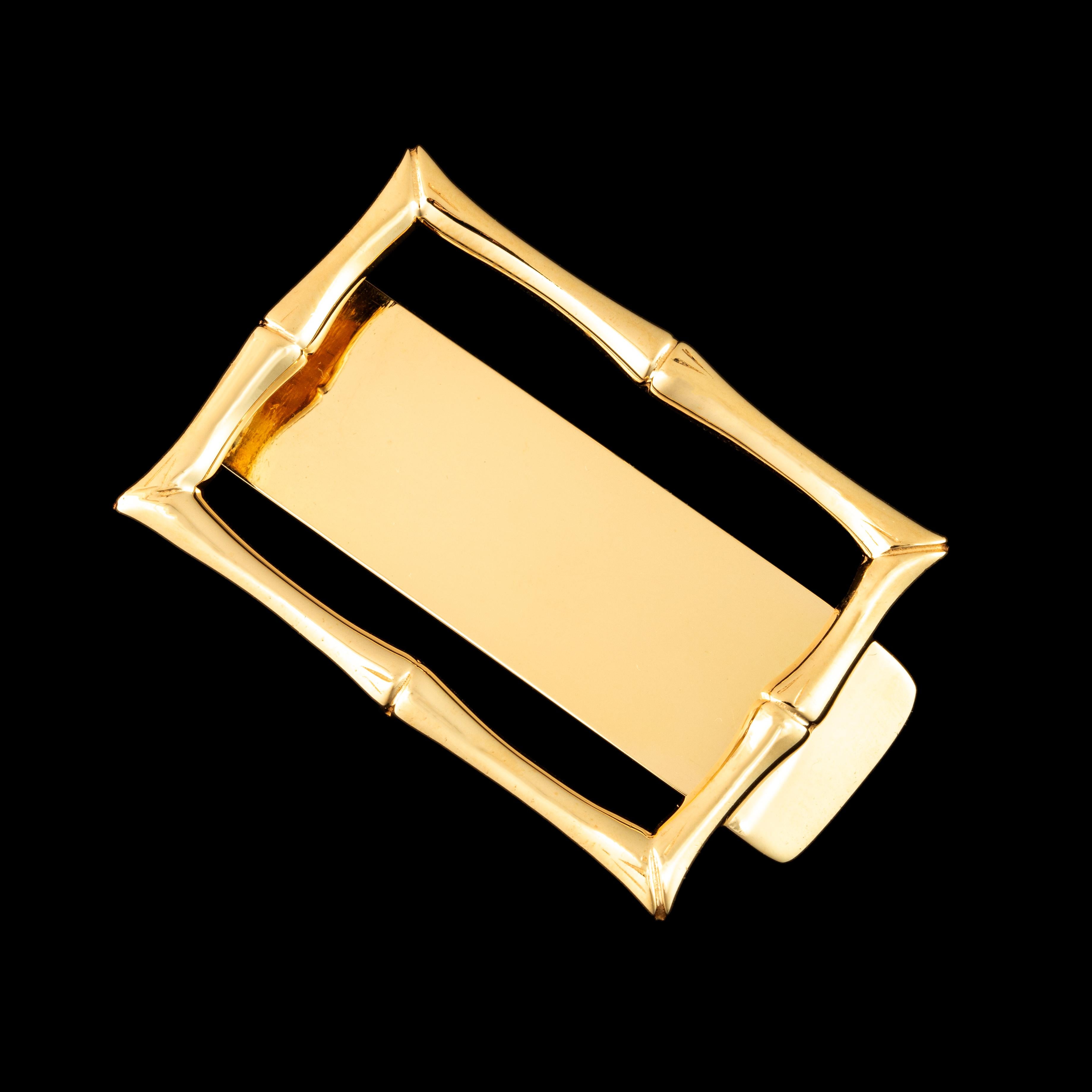 Rare pince à billets de Tiffany and Co., avec le cadre simulant un bambou, en or jaune 14kt. 
L'article est dans un état exceptionnel, sans rayures ni même signes d'utilisation. 
L'objet est poinçonné pour de l'or 14kt, il porte le cachet de Tiffany