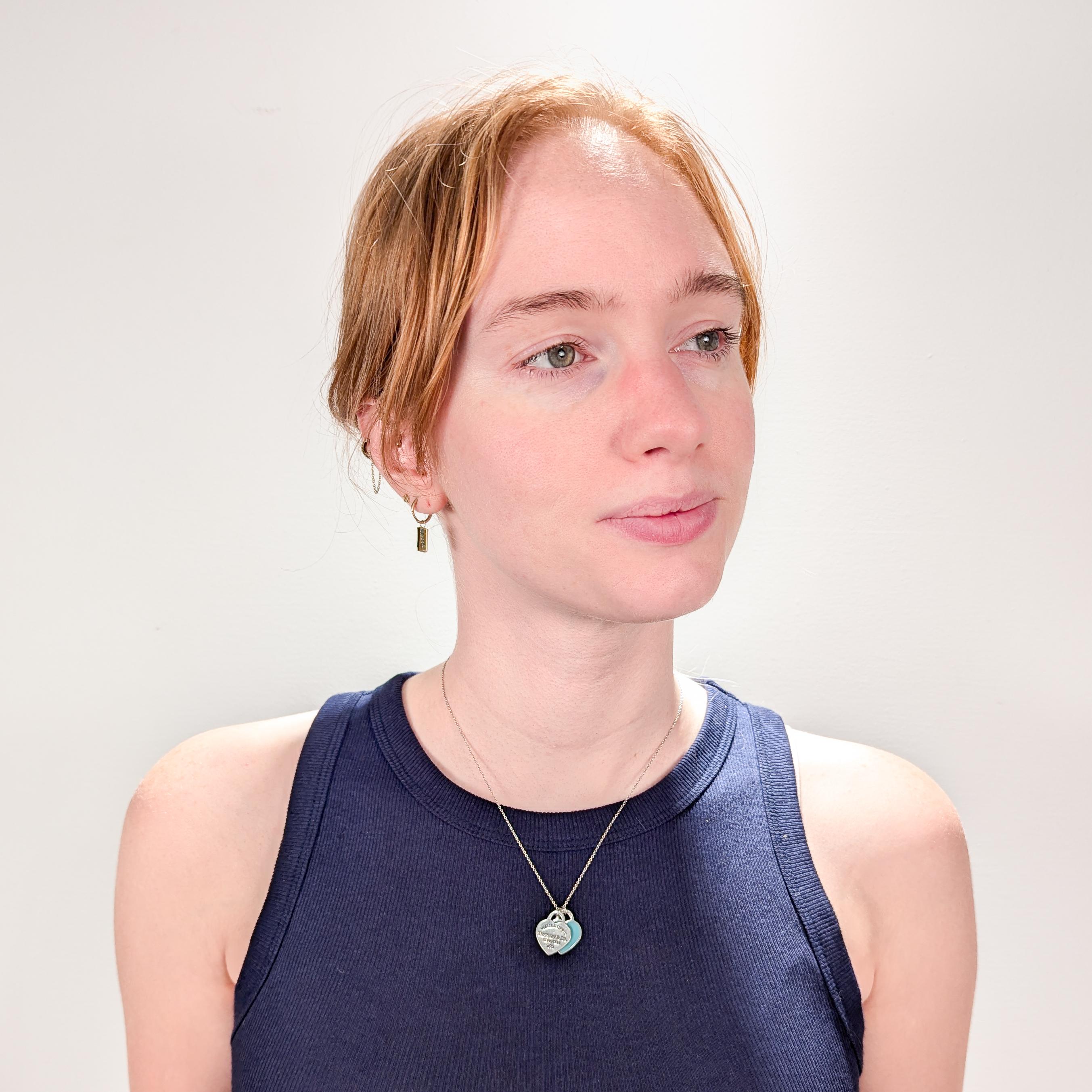 By Tiffany & Co. 

In sterling Silver. 

With a classic 'Return to Tiffany' heart tag pendant paired with a second finished in Tiffany Blue® enamel. 

Together with a Tiffany sterling silver link chain.

Fully hallmarked.

Simply wonderful Tiffany